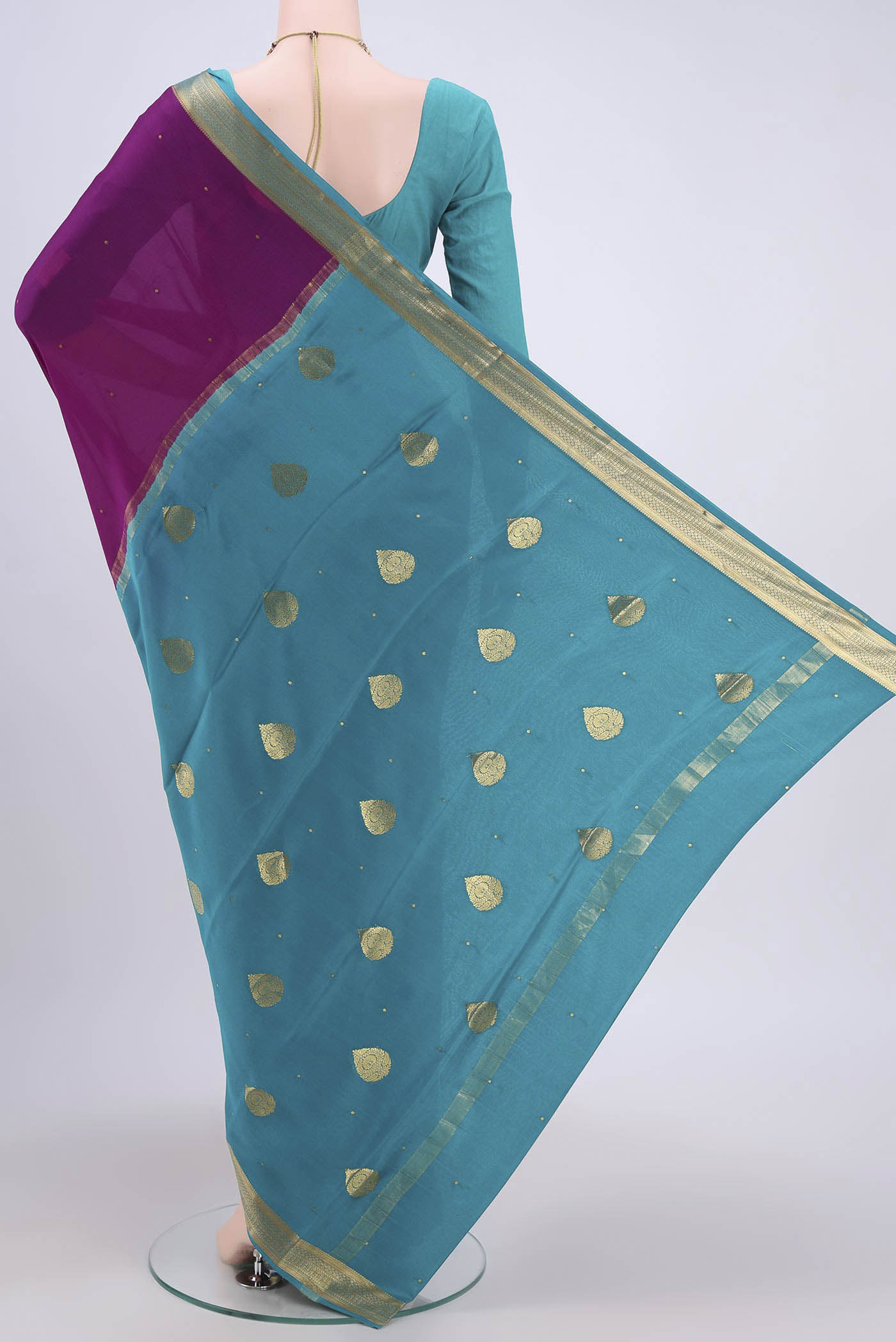 Flat view of Magenta Mysore Crepe Saree with Zari Butta on the body and Zari Border. 