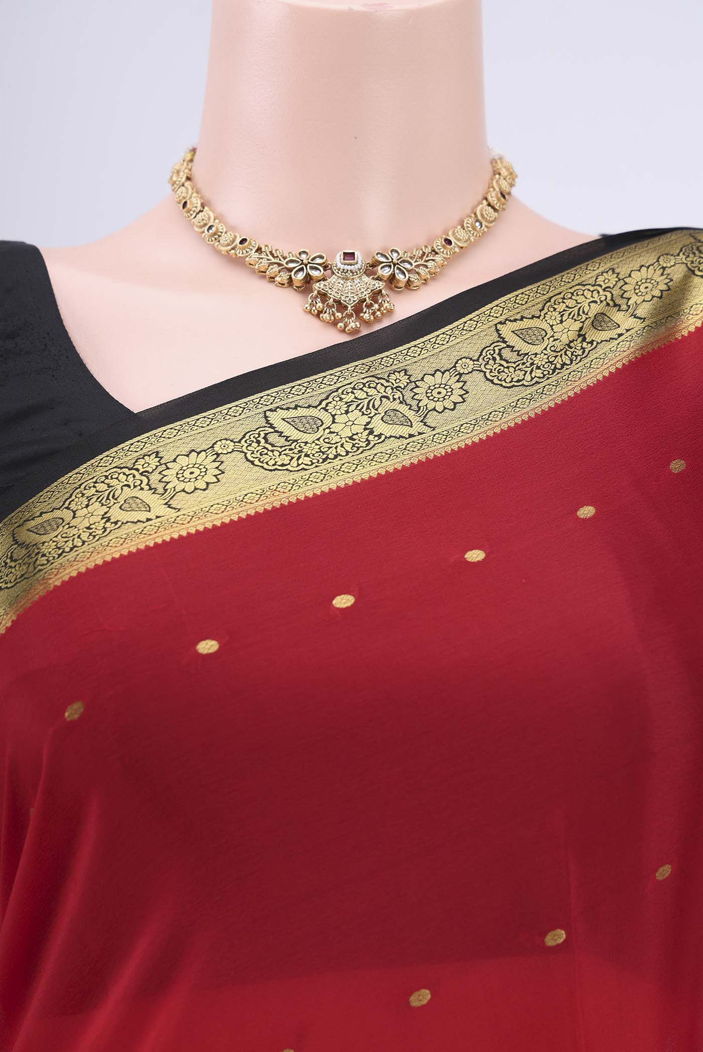 Border image of Red Mysore Crepe Saree with Zari Butta on the body and Zari Border. 