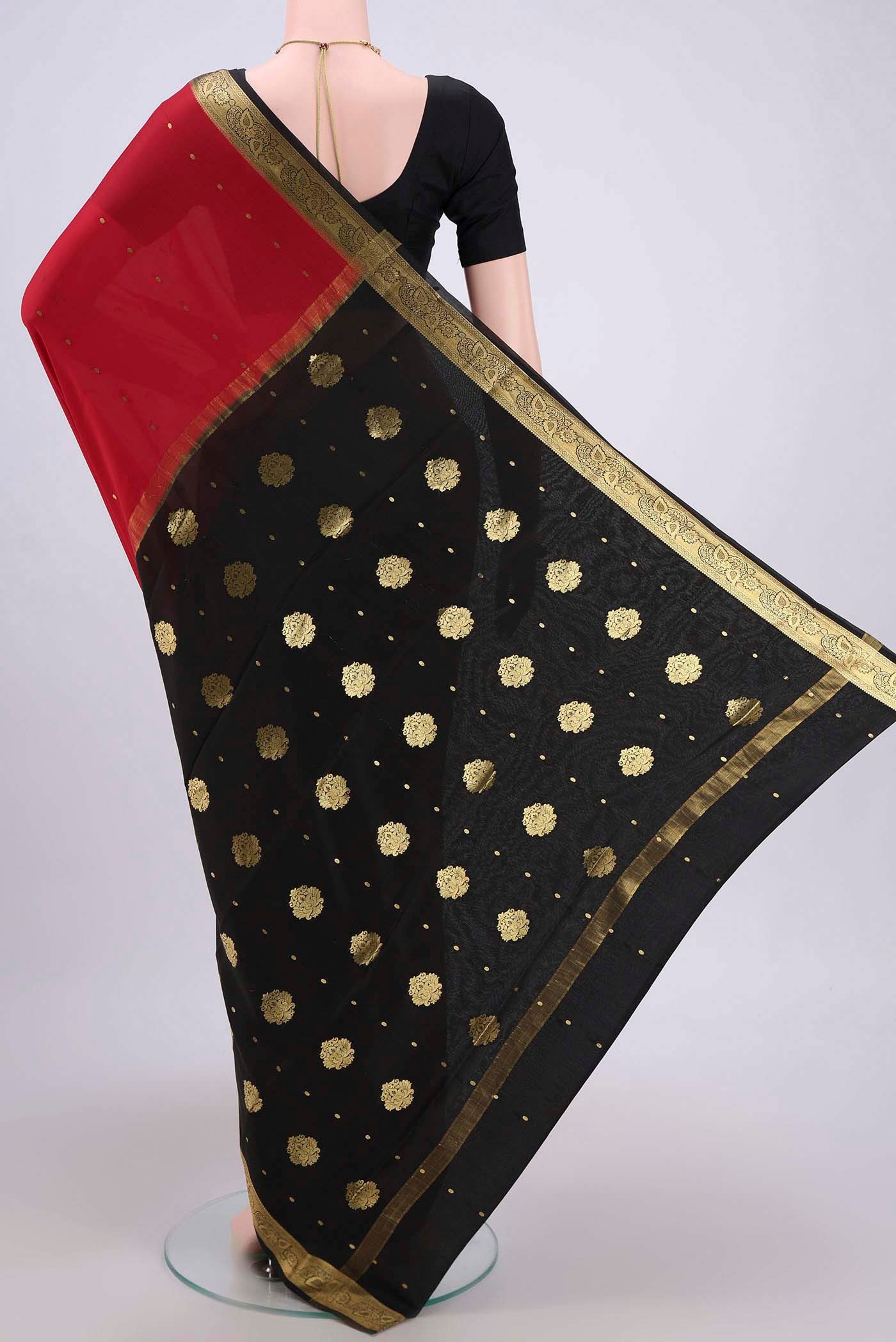 Flat view of Red Mysore Crepe Saree with Zari Butta on the body and Zari Border. 
