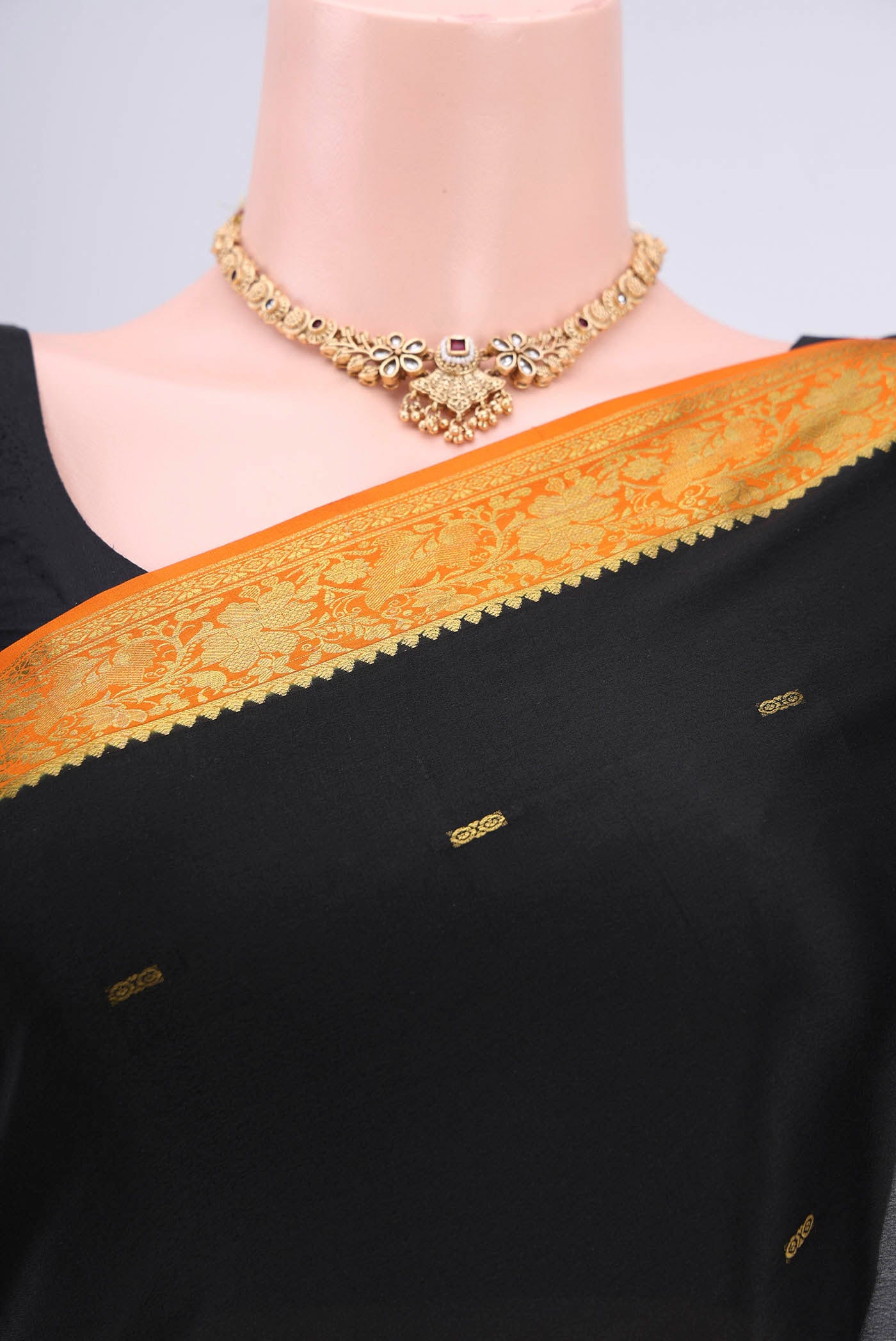 Border image of Black Mysore Crepe Saree with Zari Butta on the body and Zari Border. 