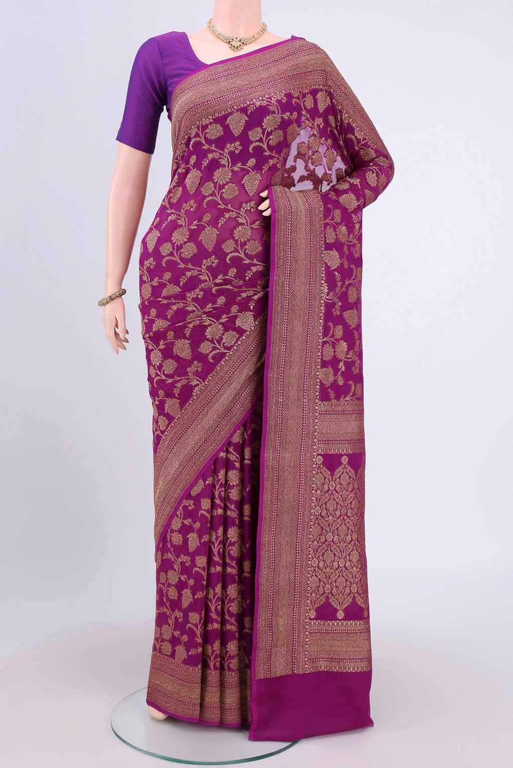 Purple Banarasi Georgette Saree with Zari Brocade on the body and Zari Border.  displayed on a mannequin