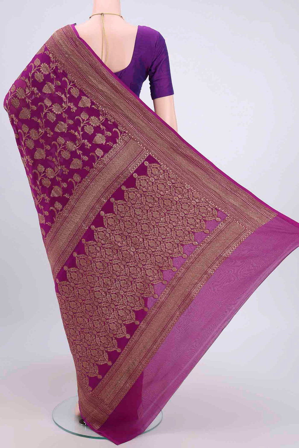 Flat view of Purple Banarasi Georgette Saree with Zari Brocade on the body and Zari Border. 
