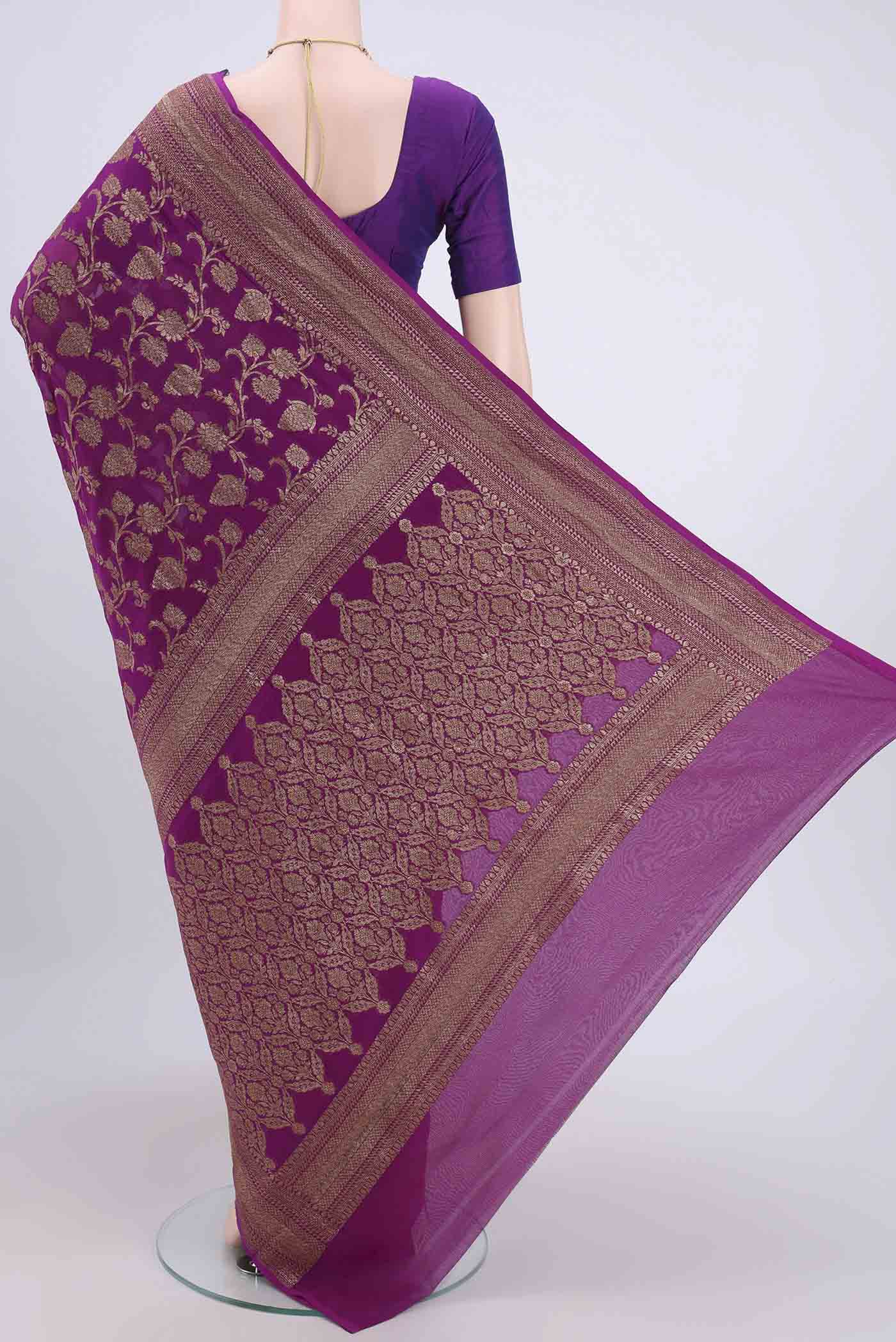 Flat view of Purple Banarasi Georgette Saree with Zari Brocade on the body and Zari Border. 