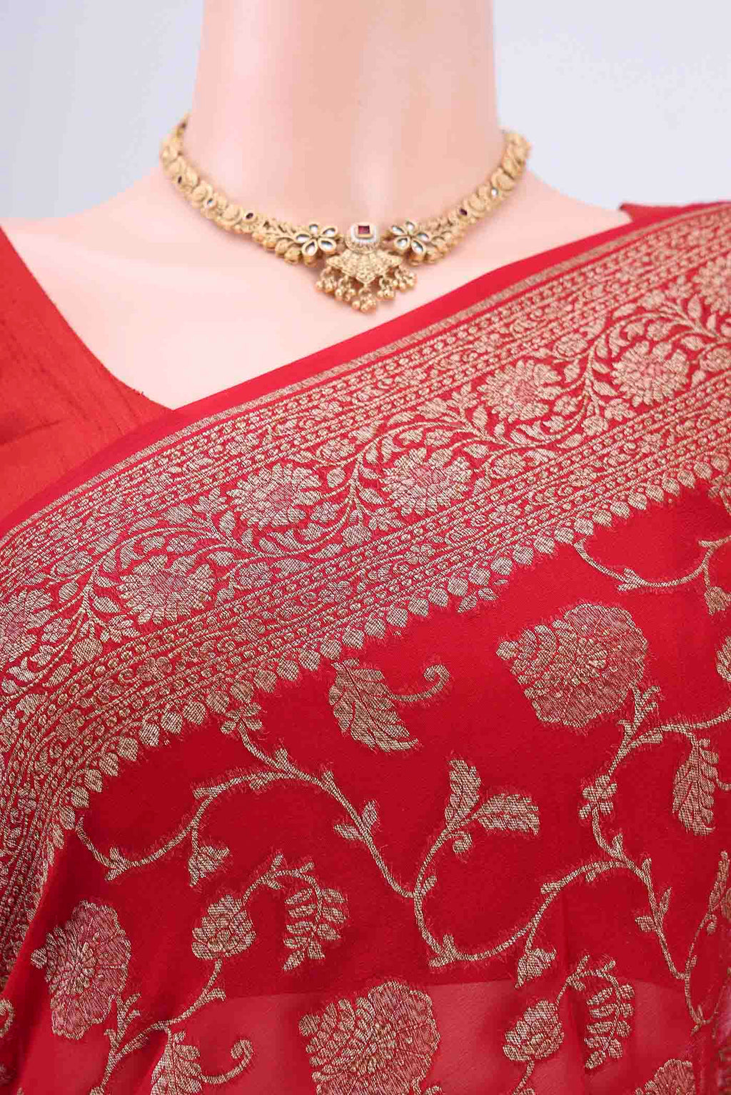 Border image of Red Banarasi Georgette Saree with Zari Brocade on the body and Zari Border. 