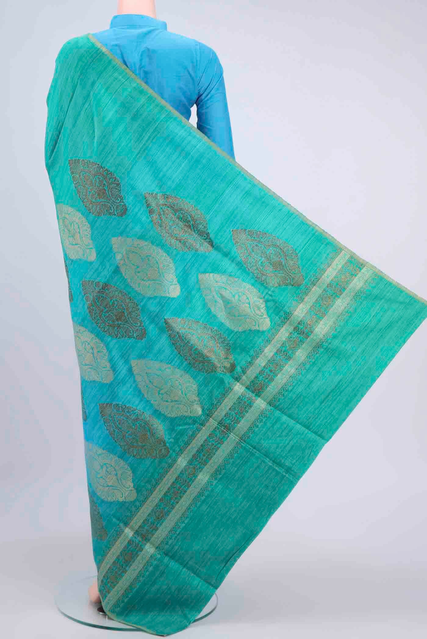 Flat view of Turquoise and Green Color Banarasi Tussar Silk Saree with Ombre design on the body and Thin Zari Line