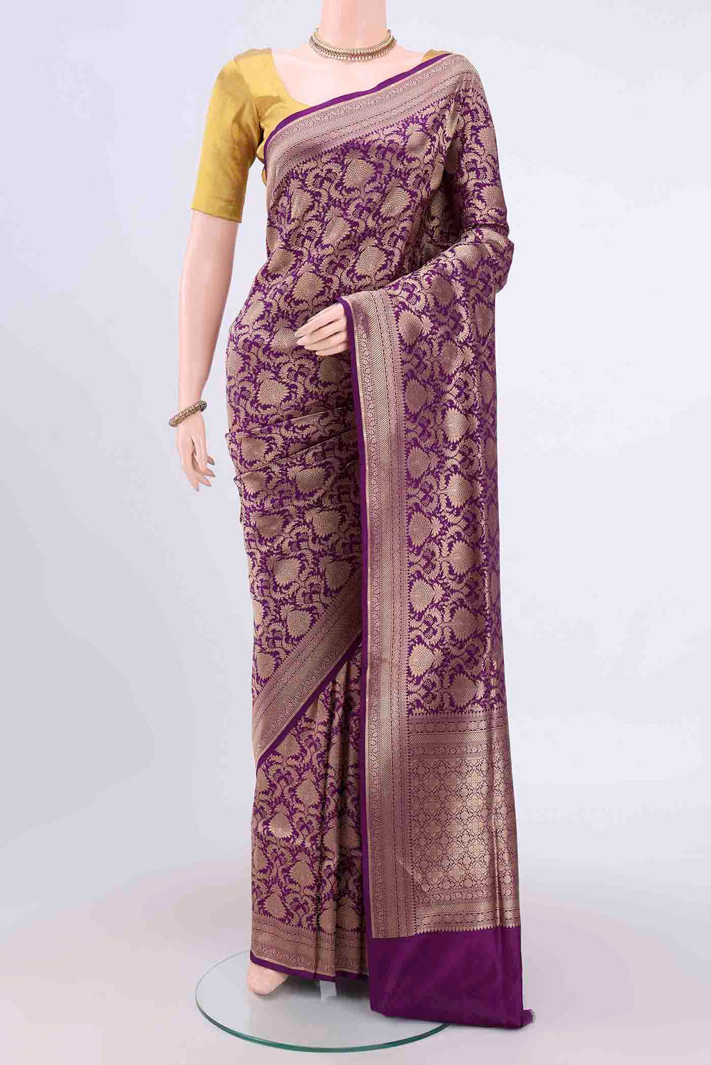 Purple Banarasi Jamavar Saree with Zari Brocade on the body and Zari Border.  displayed on a mannequin