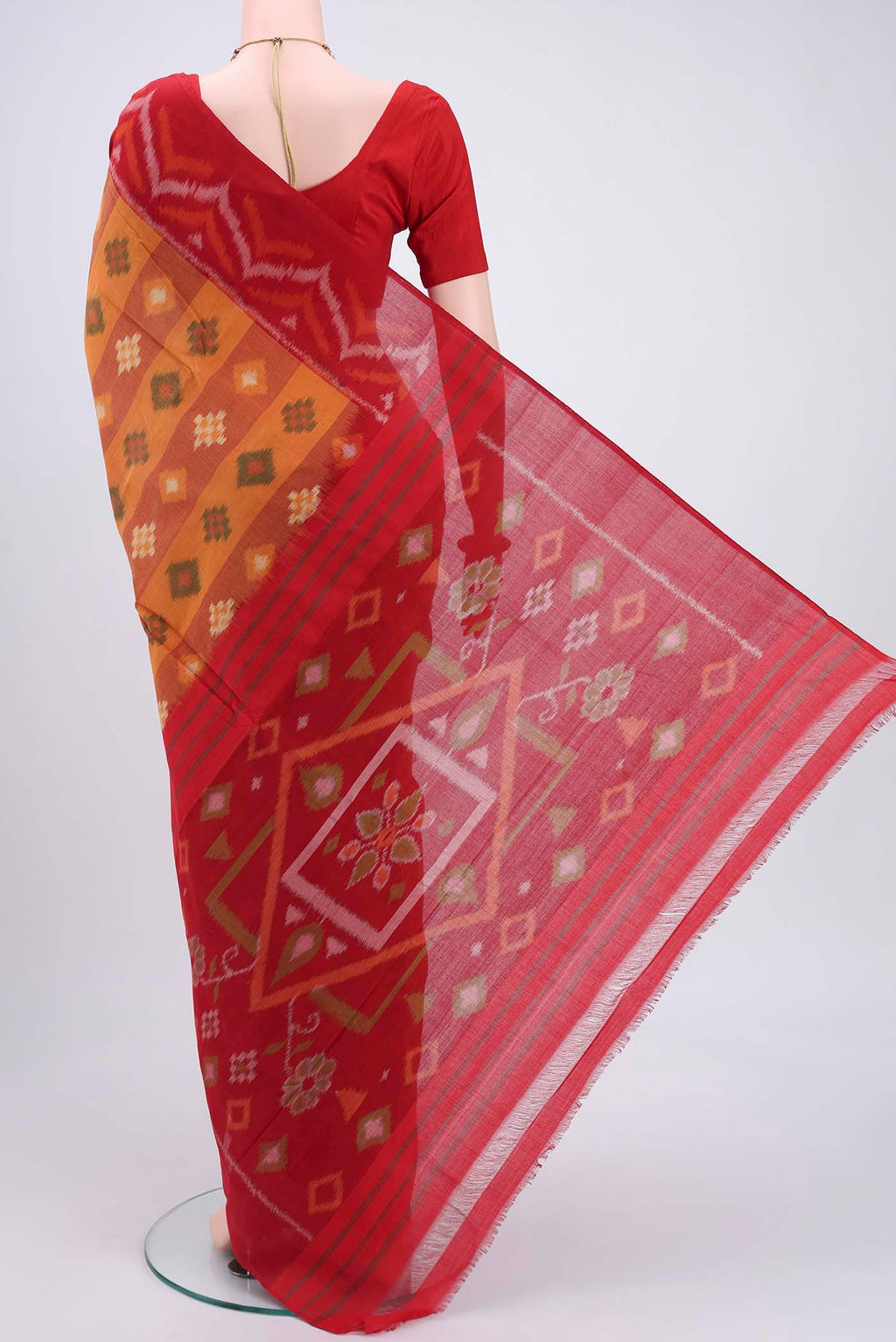 Flat view of Mustard Pochampally Cotton Saree with Ikat design on the body and Ikat Border. 