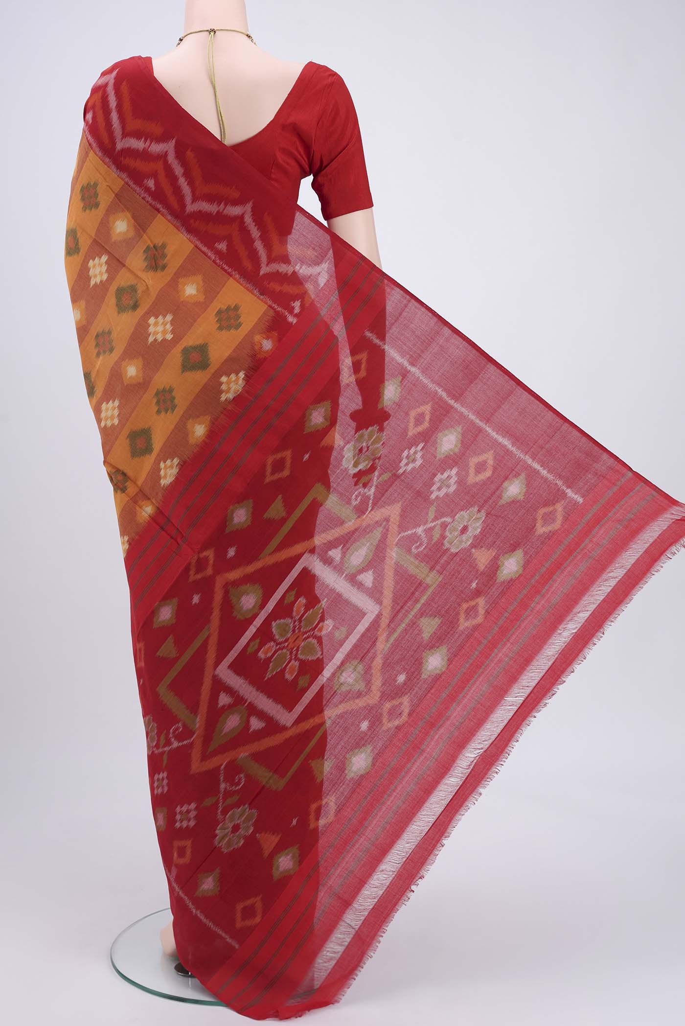 Flat view of Mustard Pochampally Cotton Saree with Ikat design on the body and Ikat Border. 