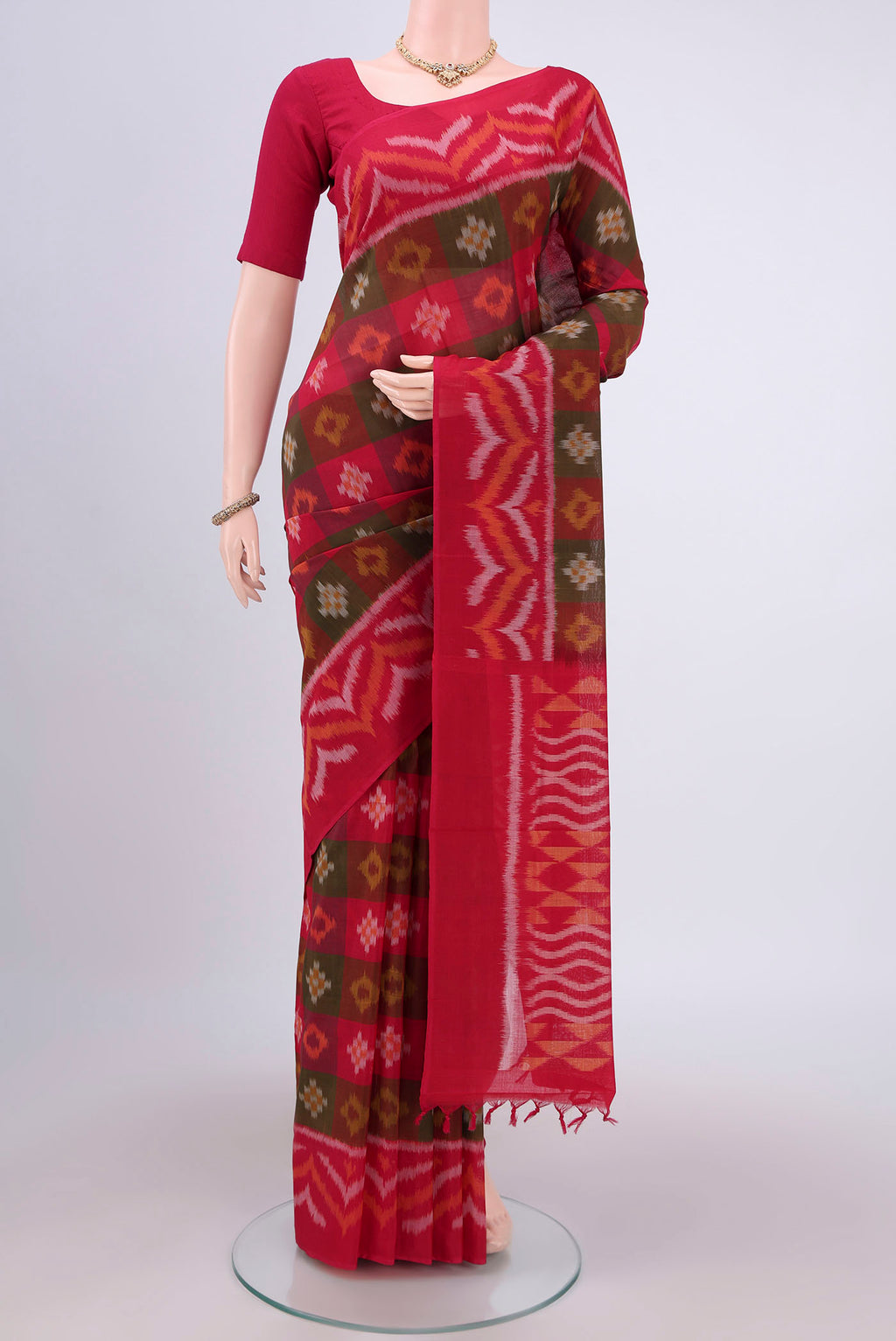 Multi Color Pochampally Cotton Saree with Ikat design on the body and Ikat Border.  displayed on a mannequin