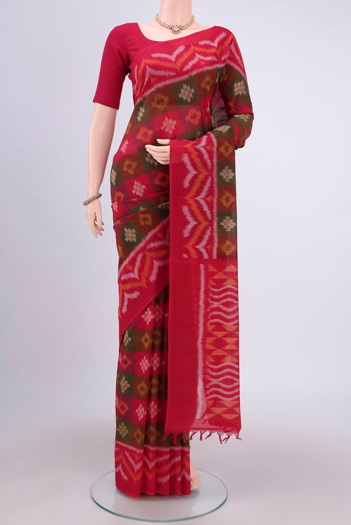 Multi Color Pochampally Cotton Saree with Ikat design on the body and Ikat Border.  displayed on a mannequin