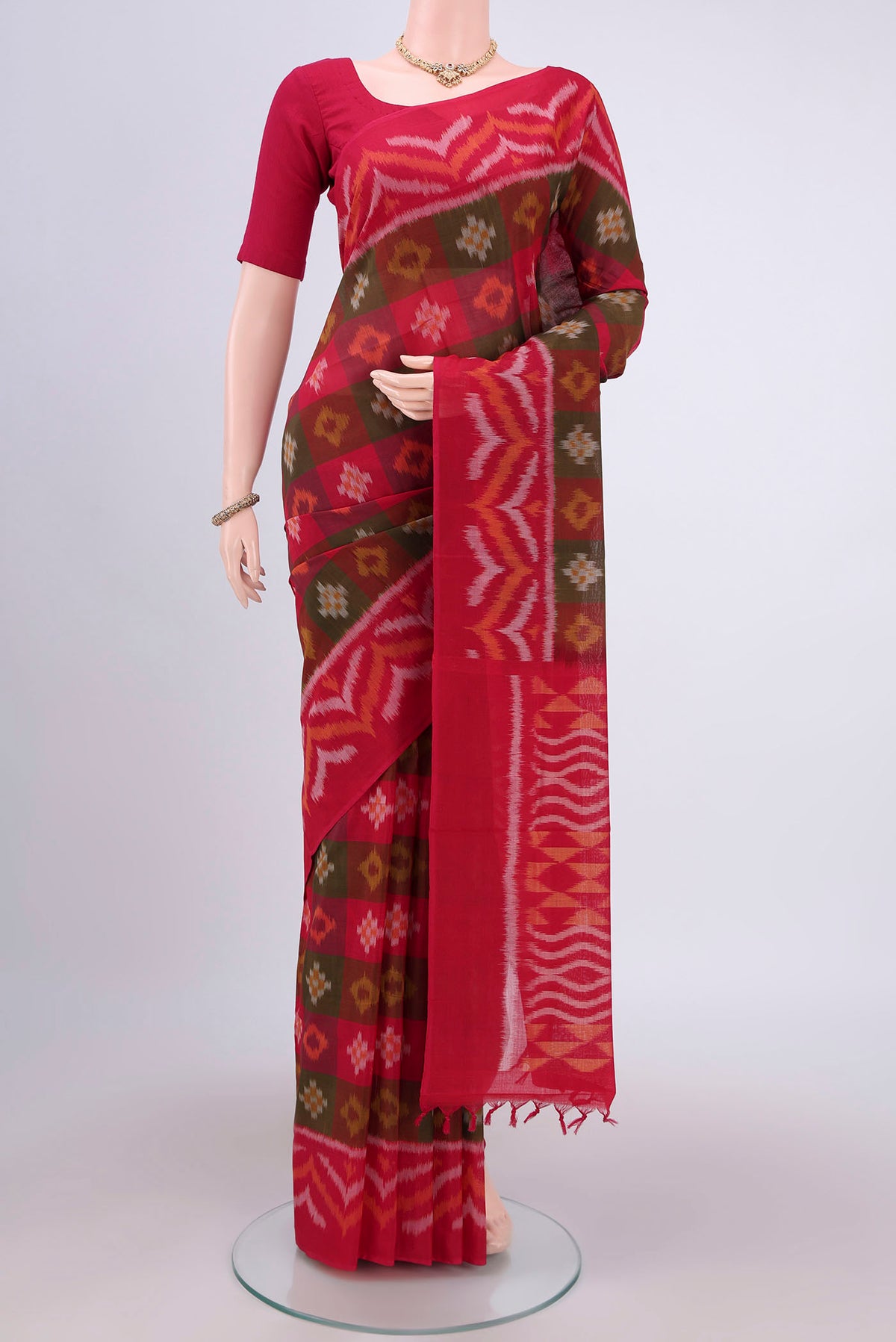 Multi Color Pochampally Cotton Saree with Ikat design on the body and Ikat Border.  displayed on a mannequin