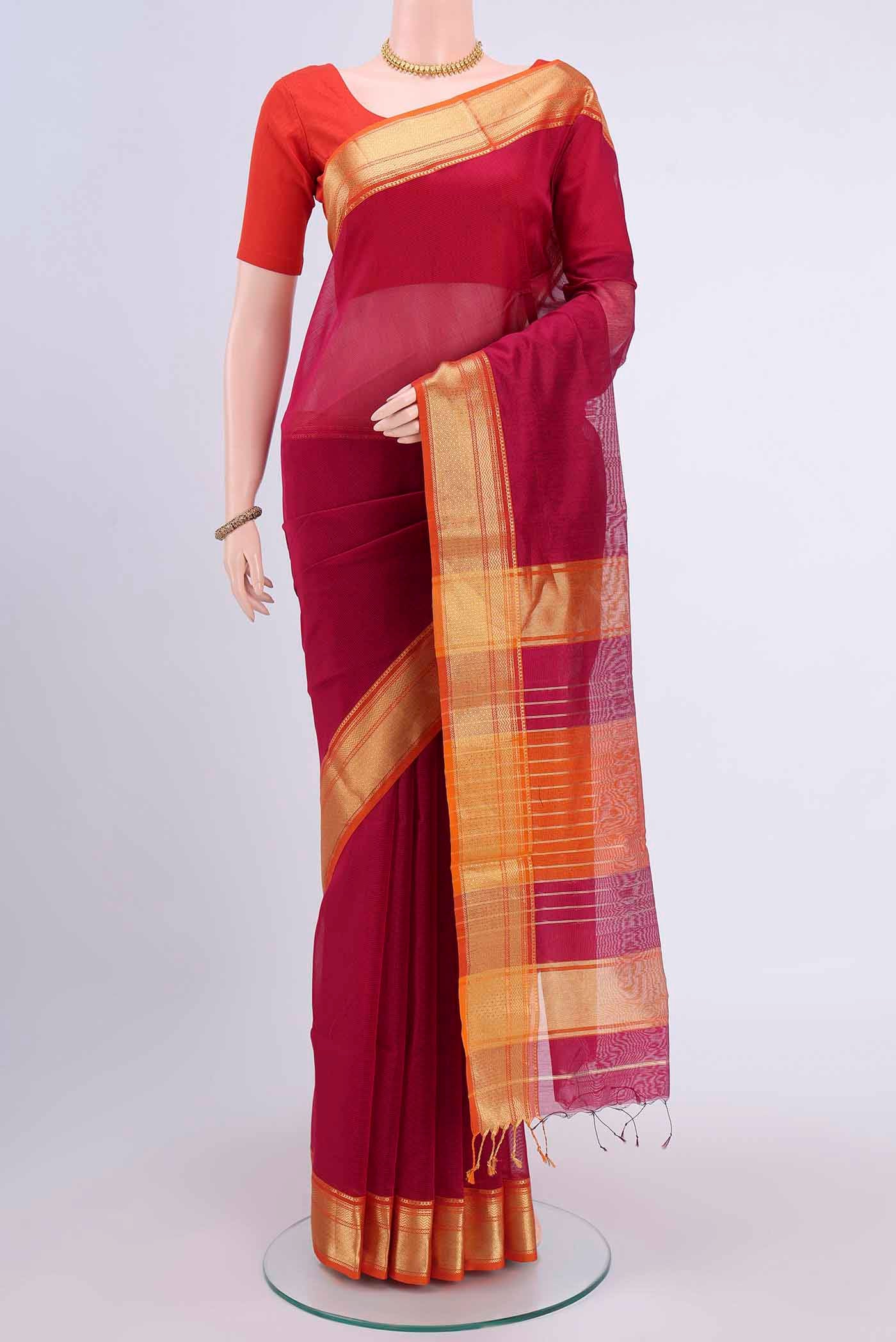 Rani Pink Maheshwari Silk Cotton Saree with Plain Body and Zari Border displayed on a mannequin