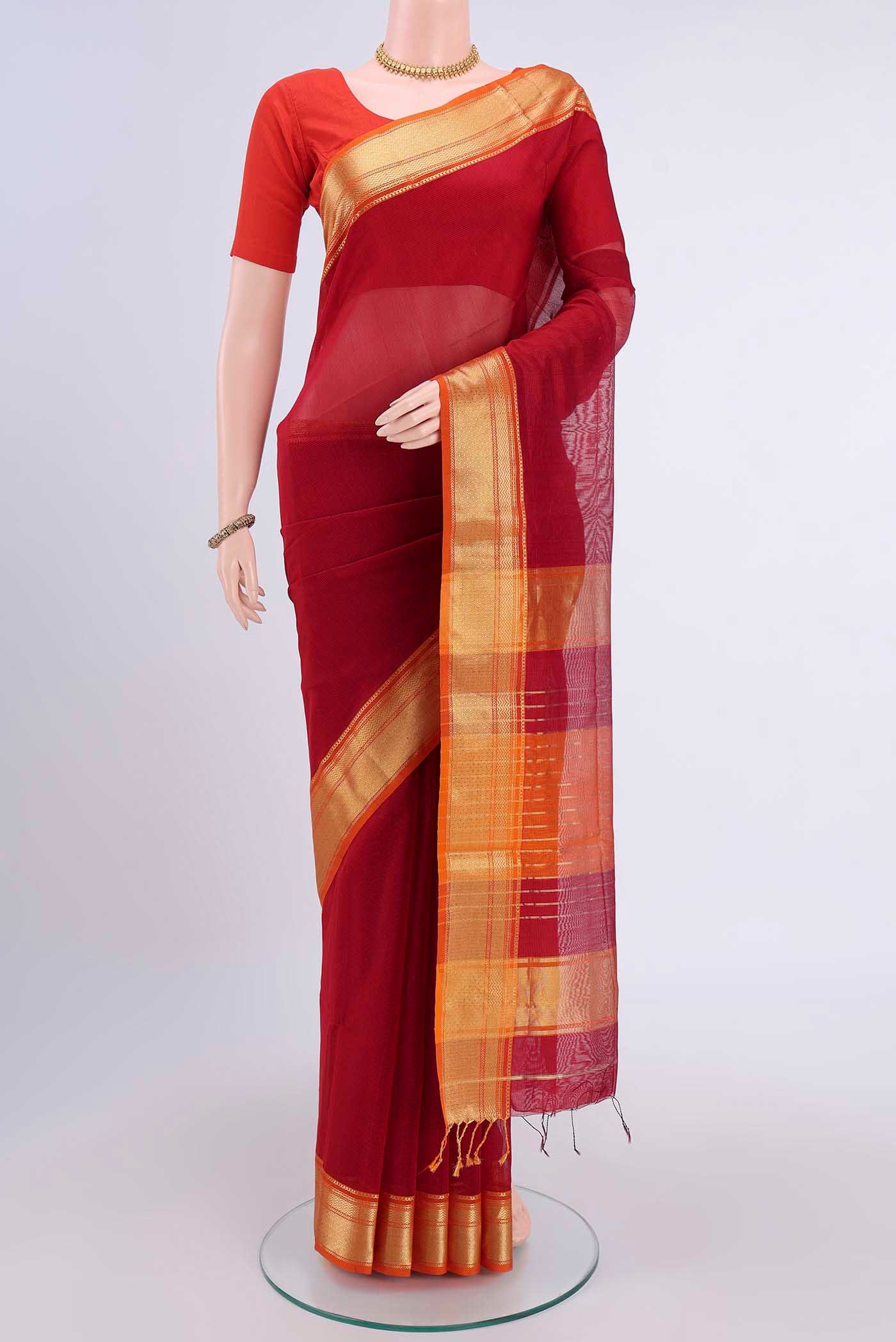 Maroon Maheshwari Silk Cotton Saree with Plain Body and Zari Border displayed on a mannequin