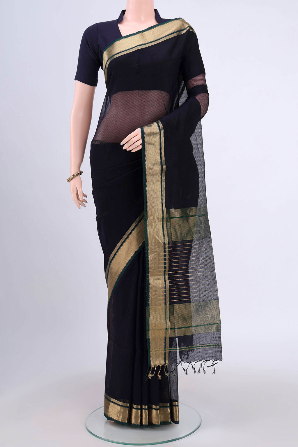 Navy Blue Maheshwari Silk Cotton Saree with Plain Body and Zari Border.  displayed on a mannequin