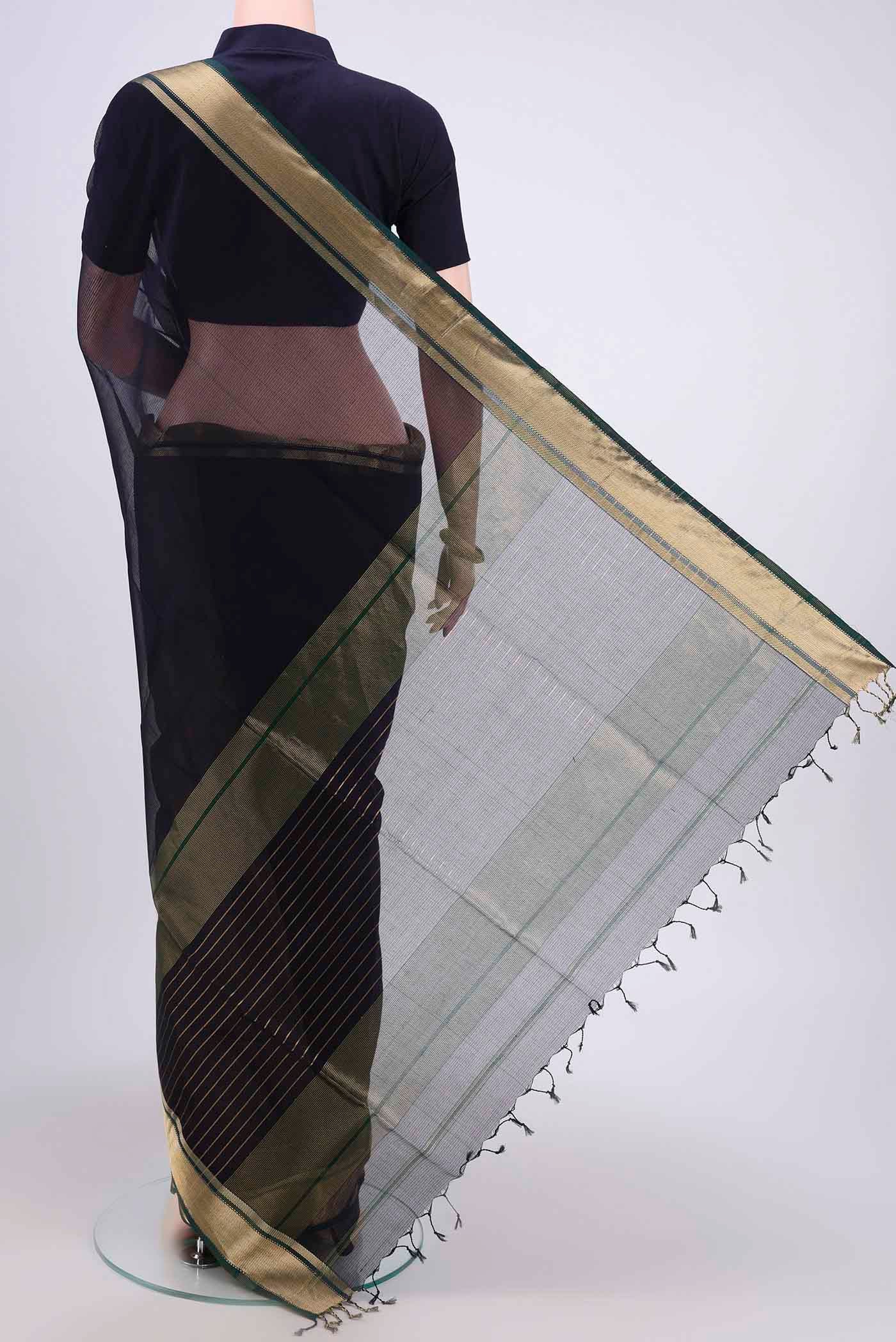 Flat view of Navy Blue Maheshwari Silk Cotton Saree with Plain Body and Zari Border. 