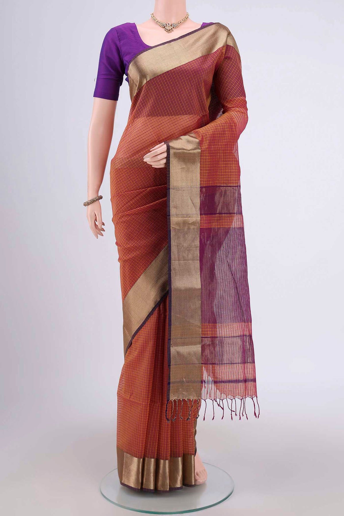 Mustard Maheshwari Silk Cotton Saree with Stripes on the body and Zari Border.  displayed on a mannequin
