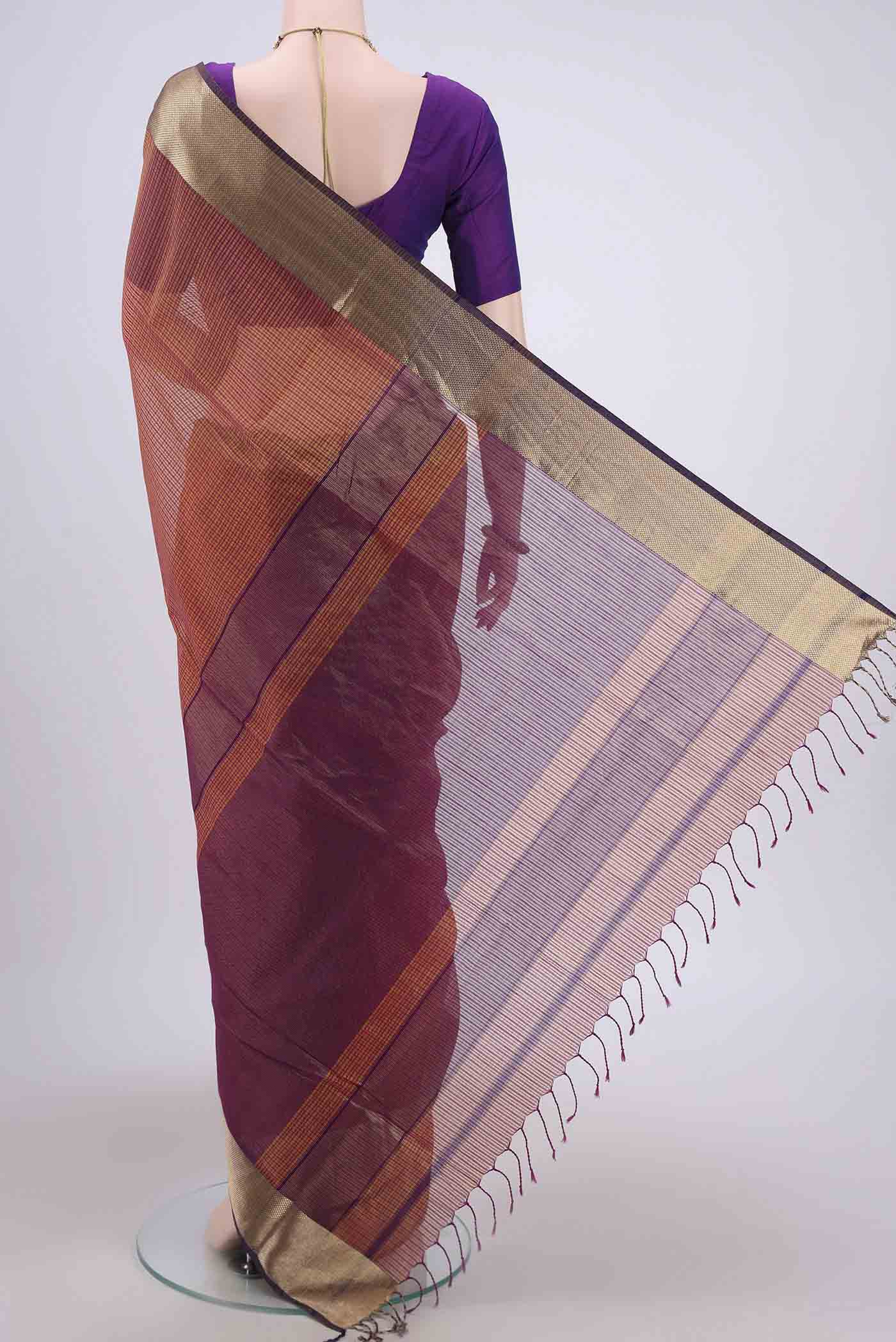 Flat view of Mustard Maheshwari Silk Cotton Saree with Stripes on the body and Zari Border. 