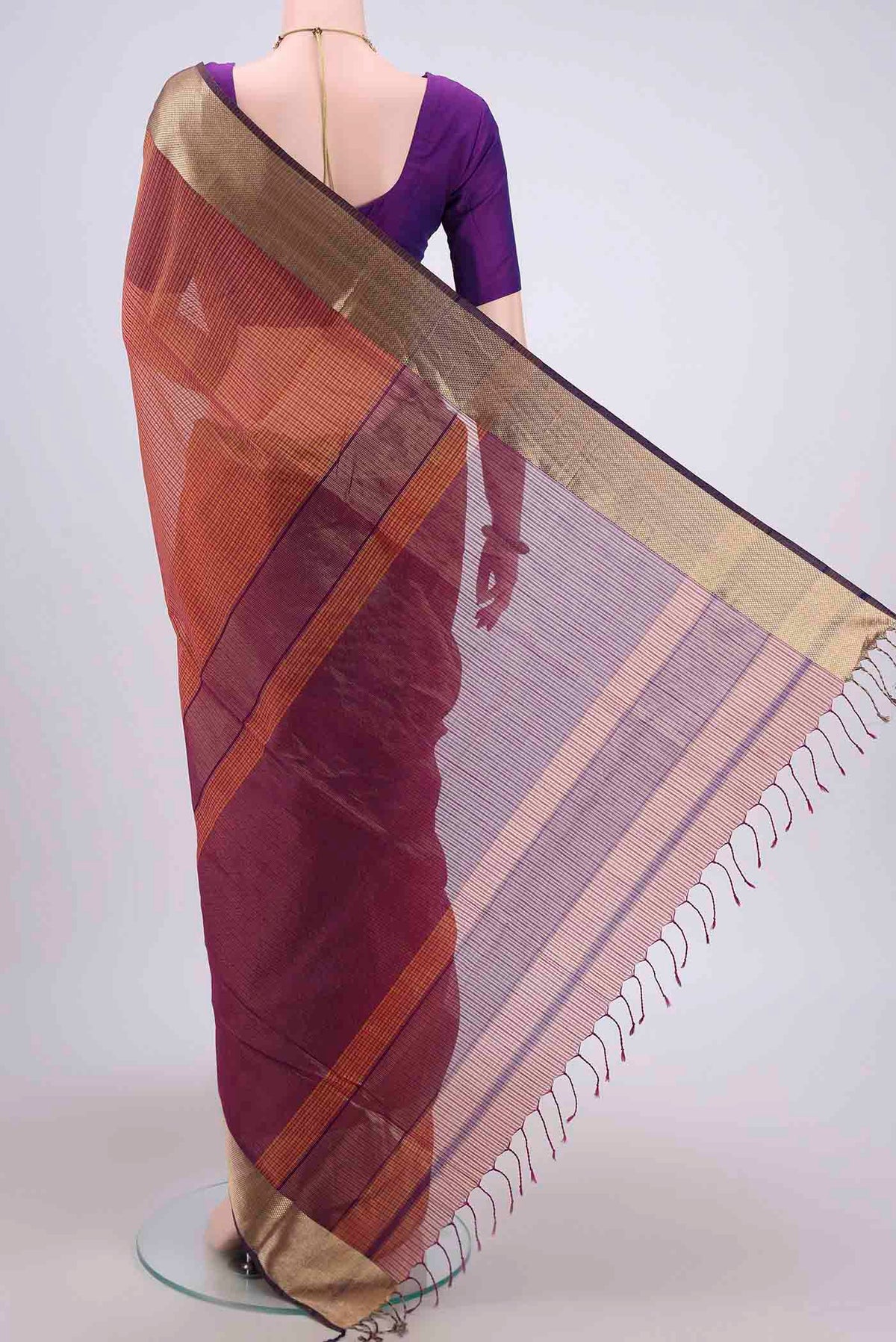 Flat view of Mustard Maheshwari Silk Cotton Saree with Stripes on the body and Zari Border. 