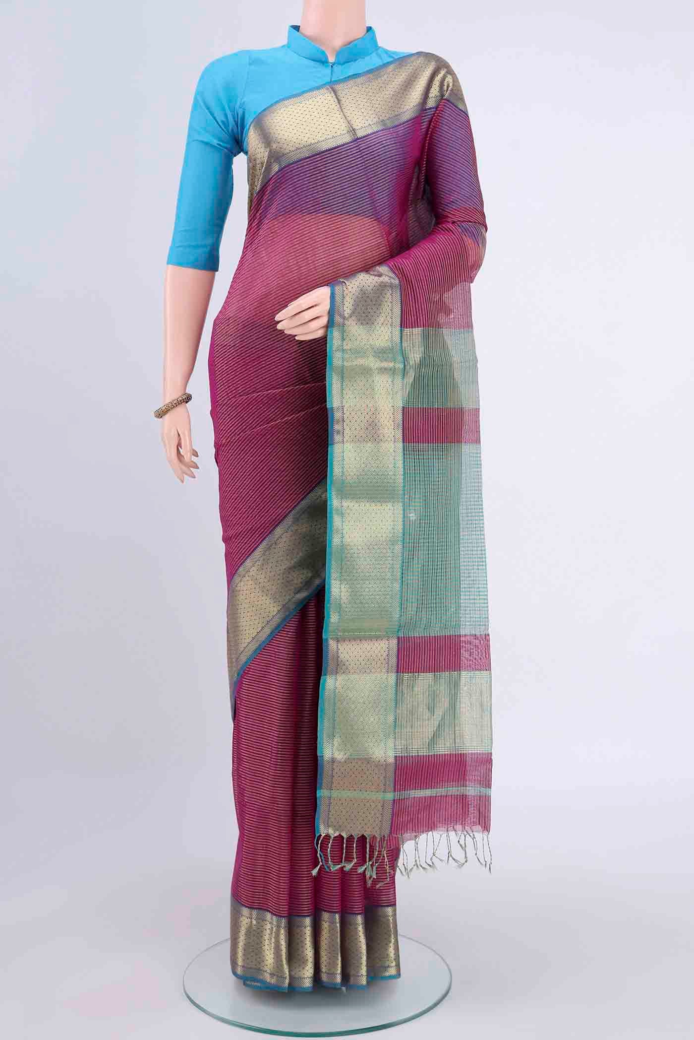 Magenta Maheshwari Silk Cotton Saree with Stripes on the body and Zari Border displayed on a mannequin