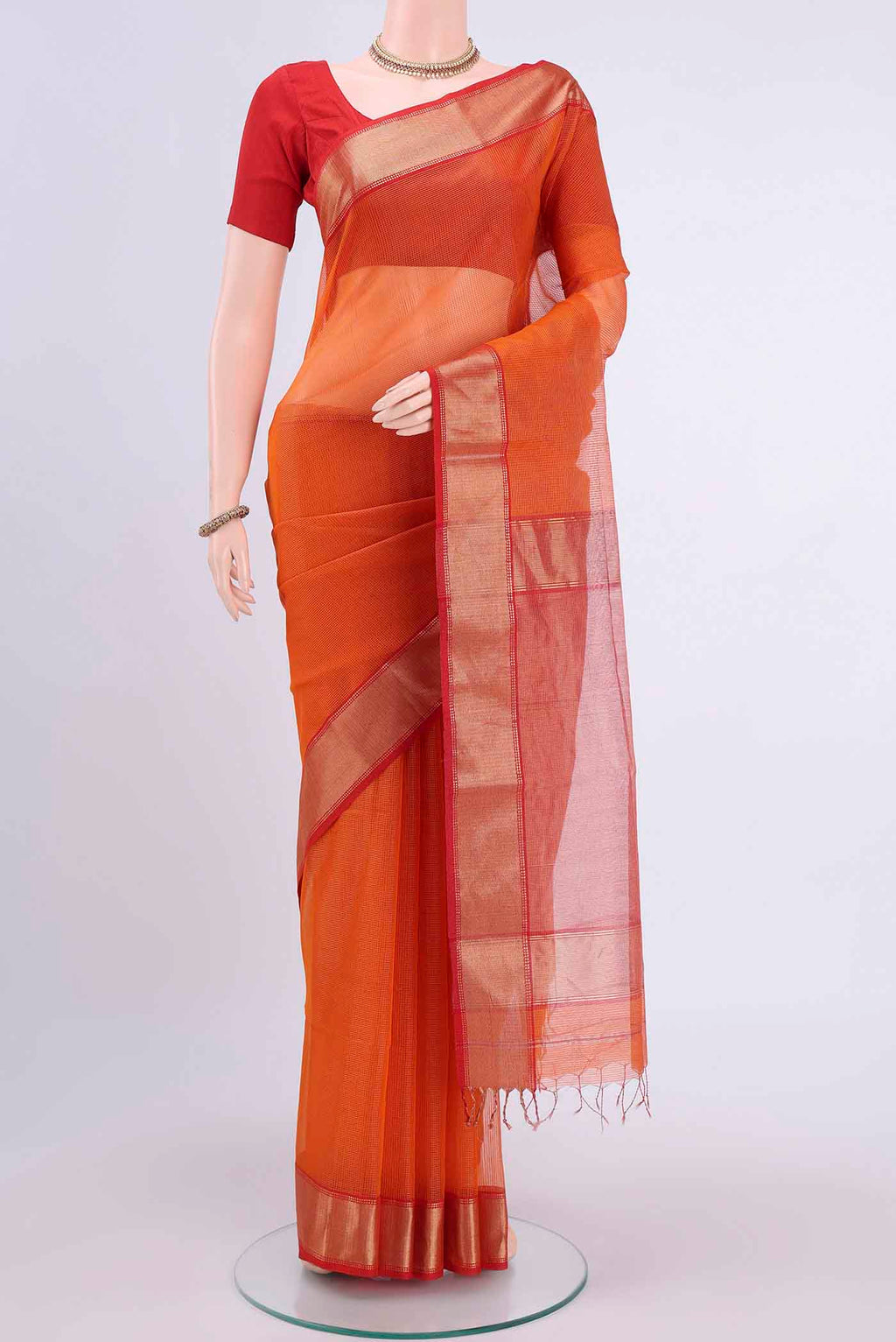 Orange Maheshwari Silk Cotton Saree with Checked design on the body and Zari Border displayed on a mannequin