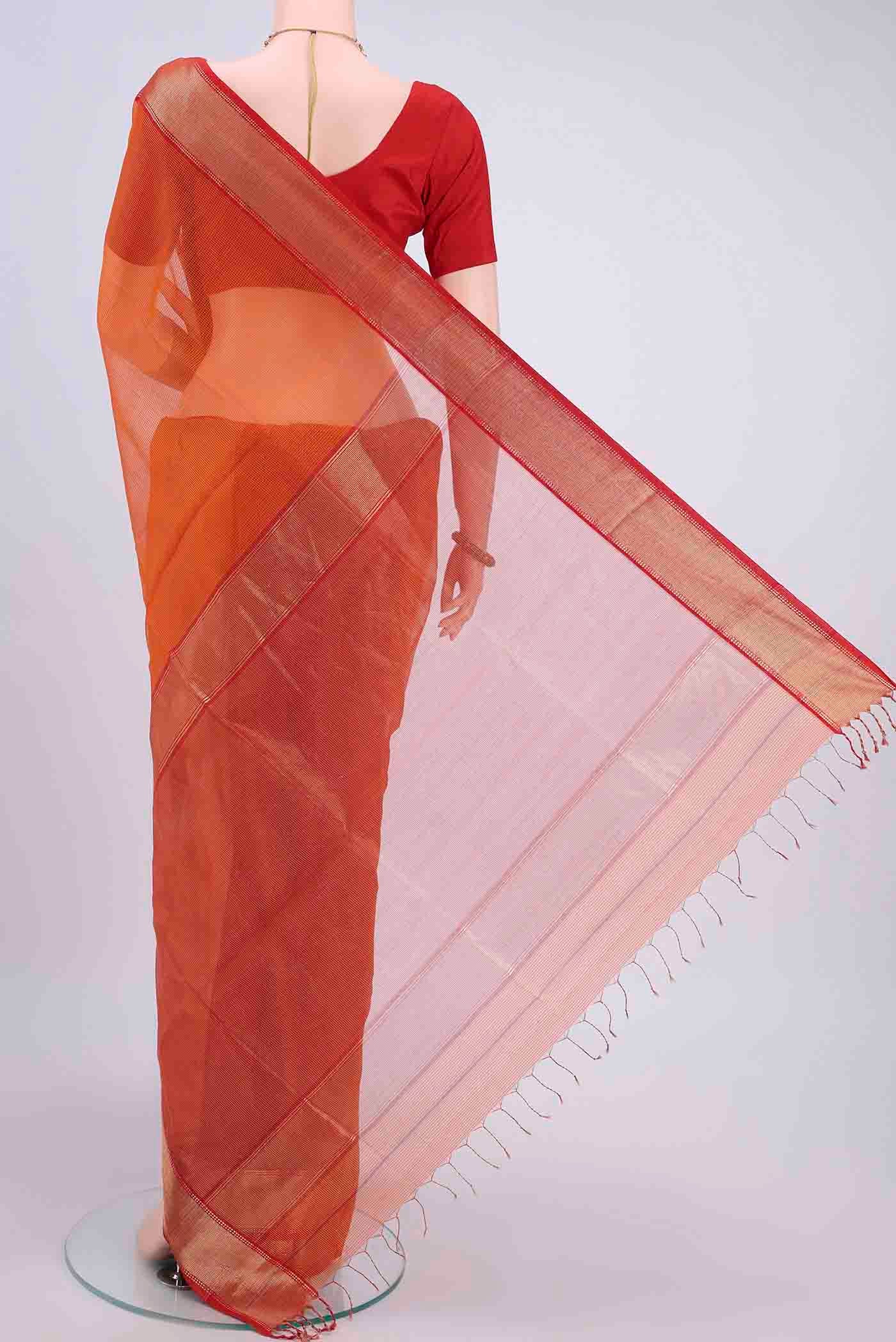 Flat view of Orange Maheshwari Silk Cotton Saree with Checked design on the body and Zari Border