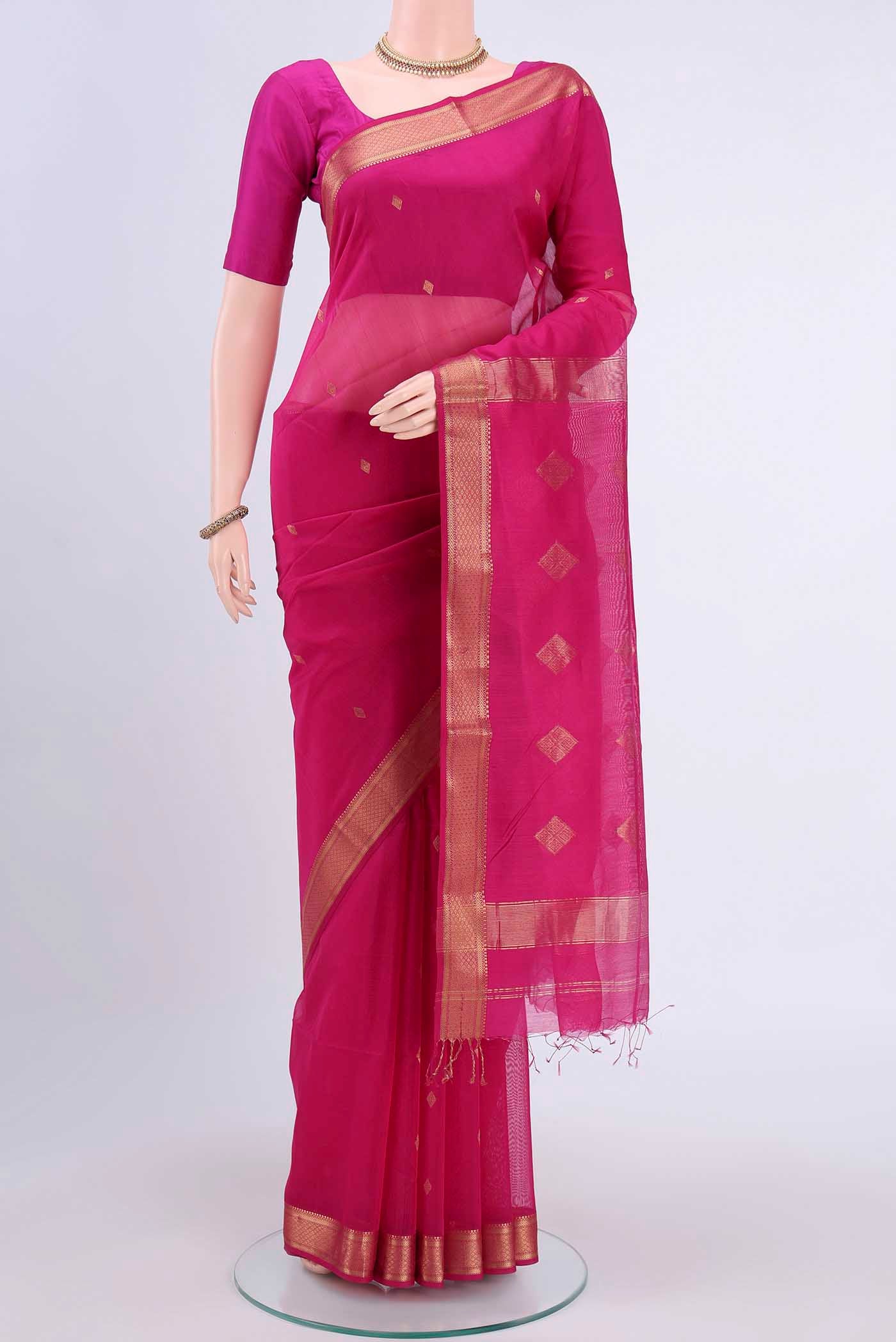 Rani Pink Maheshwari Silk Cotton Saree with Zari Butta on the body and Zari Border displayed on a mannequin