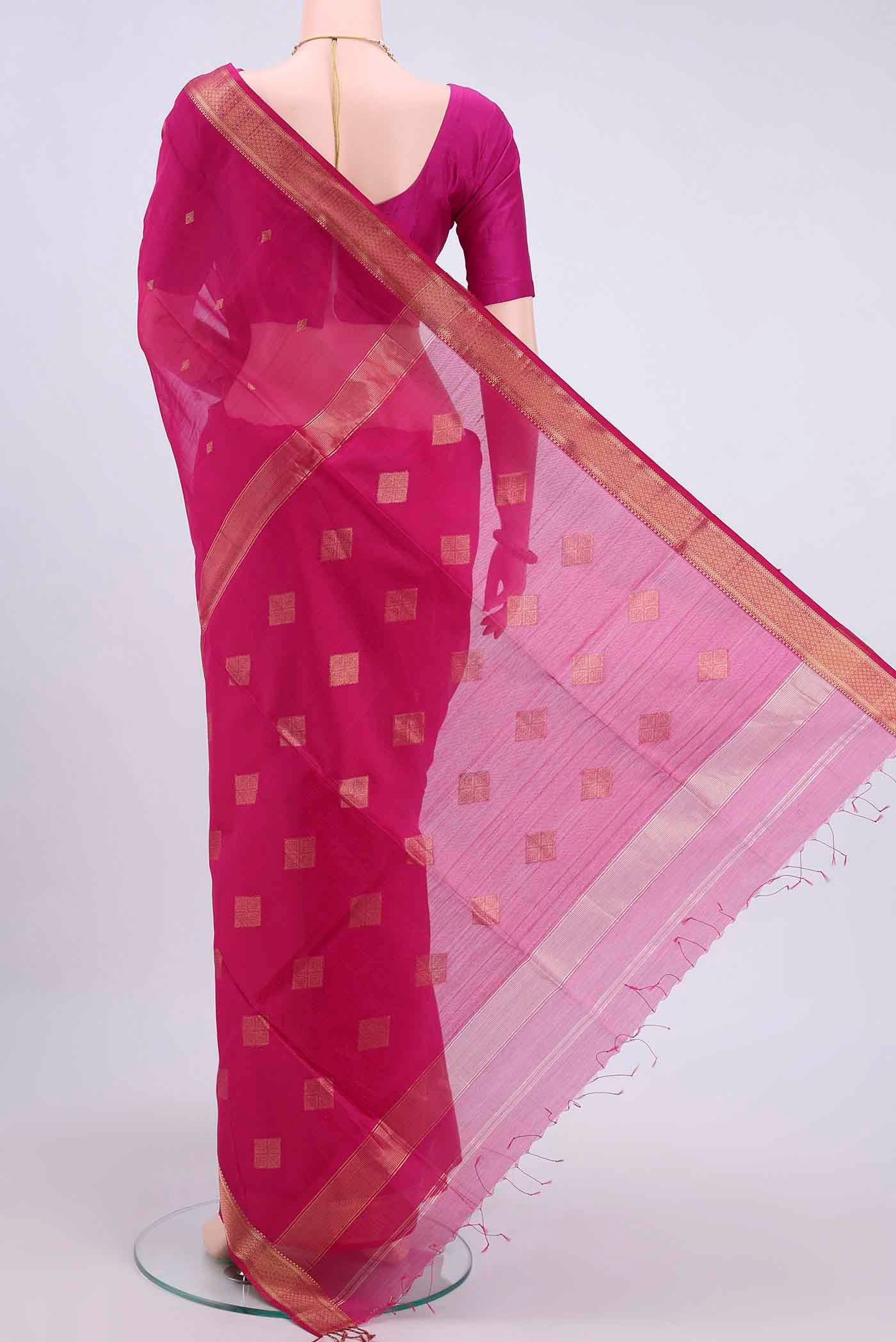 Flat view of Rani Pink Maheshwari Silk Cotton Saree with Zari Butta on the body and Zari Border