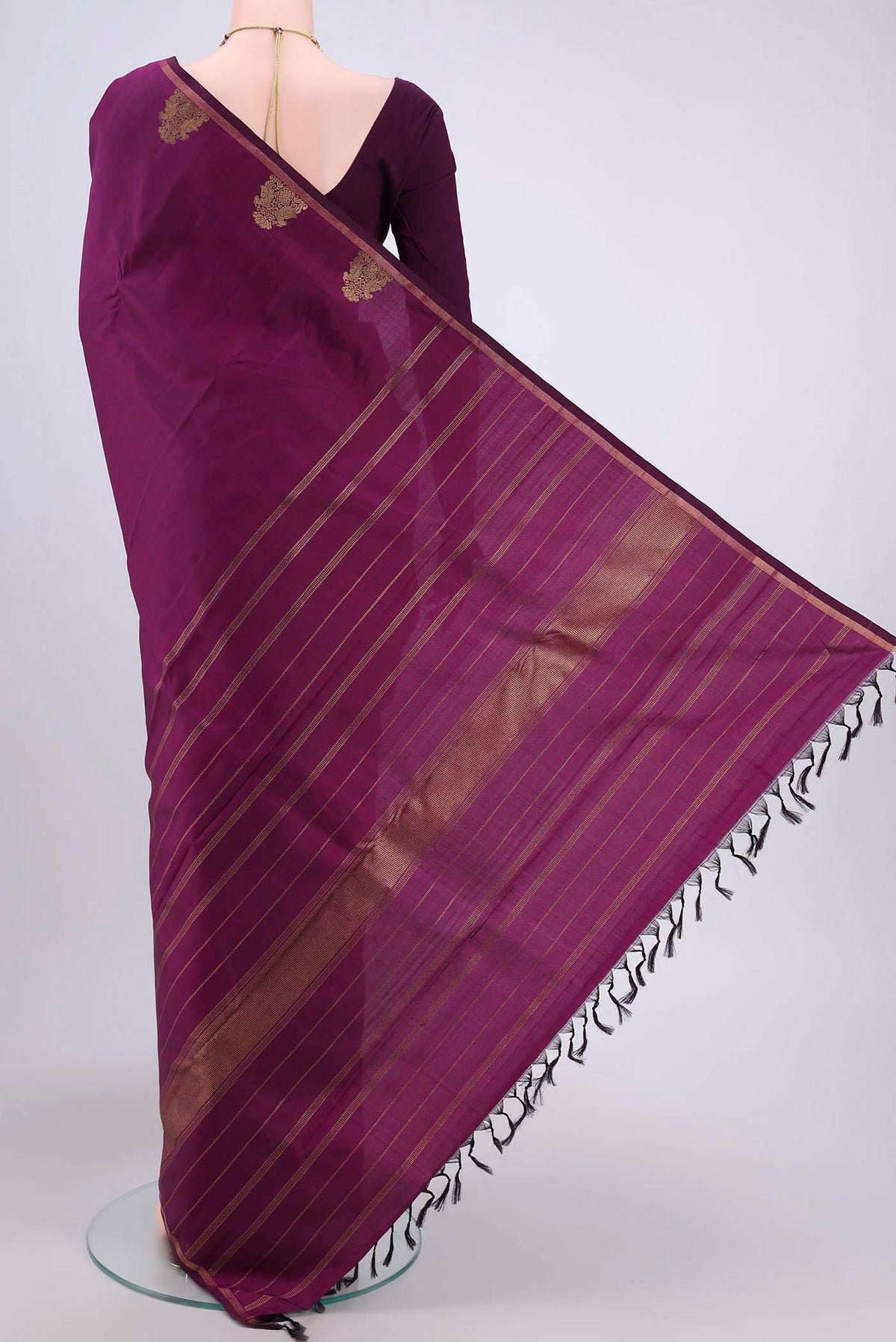 Flat view of Pure Silk Pure Zari Purple Kanjivaram Saree with Zari Butta on the body and Thin Zari Line. 