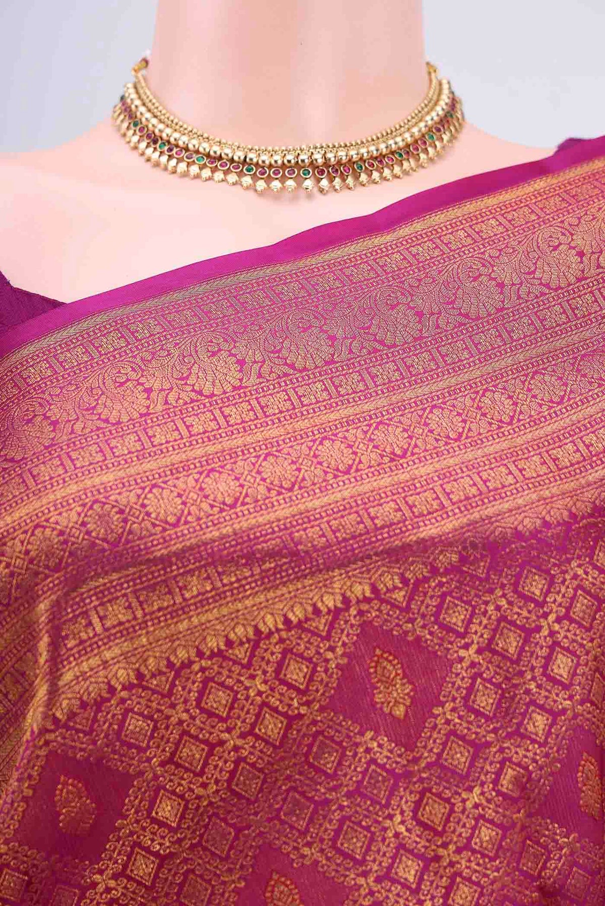 Border image of Magenta Kanchipuram Silk Saree with Zari Brocade on the body and Zari Border