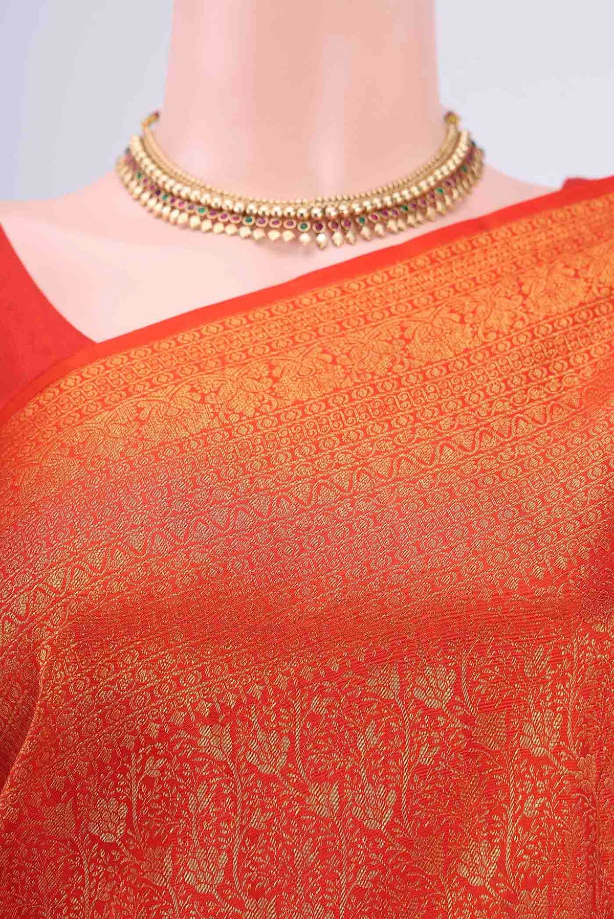Border image of Orange Kanchipuram Silk Saree with Zari Brocade on the body and Zari Border
