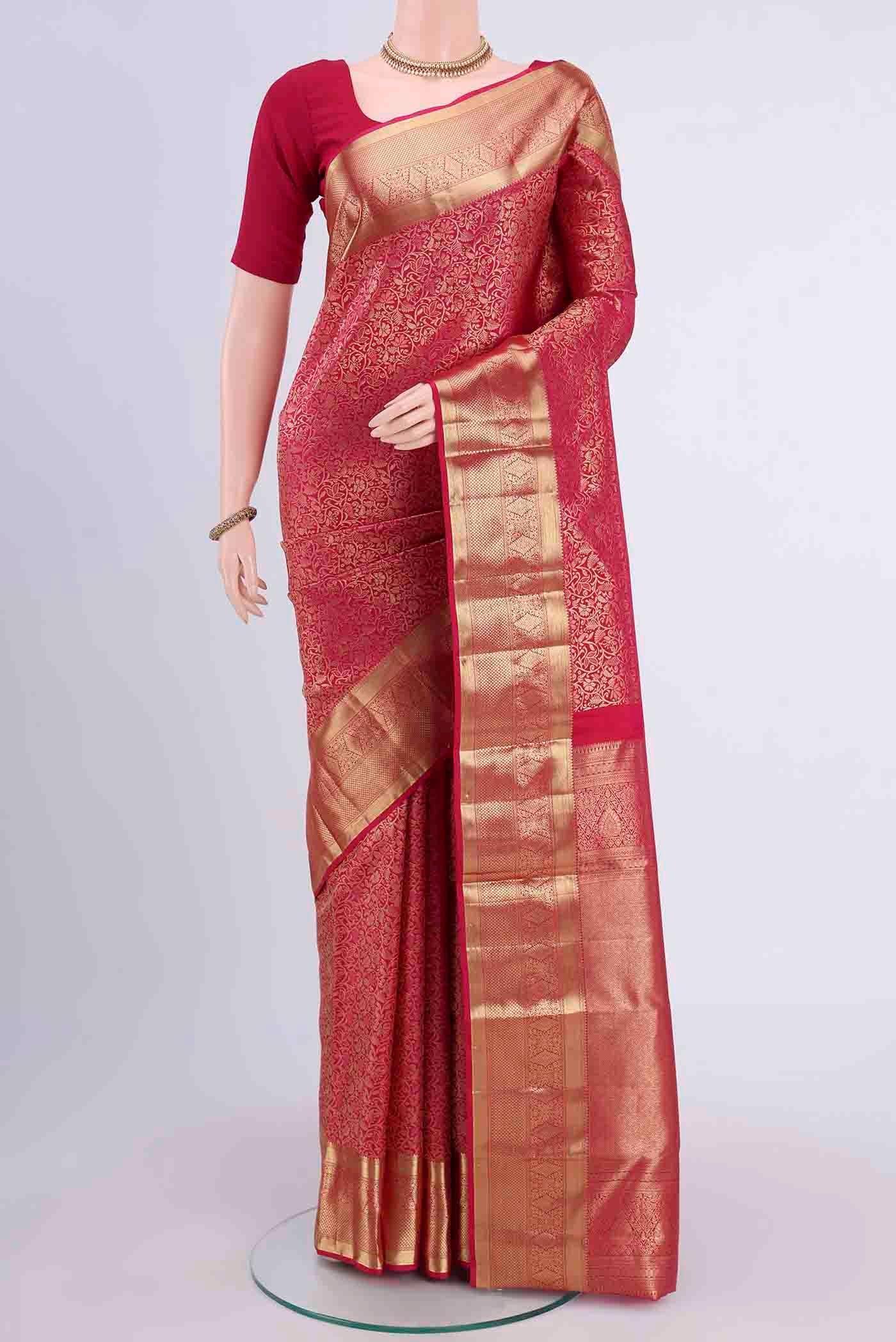 Dark Pink Kanchipuram Saree with Zari Brocade on the body and Zari Border displayed on a mannequin