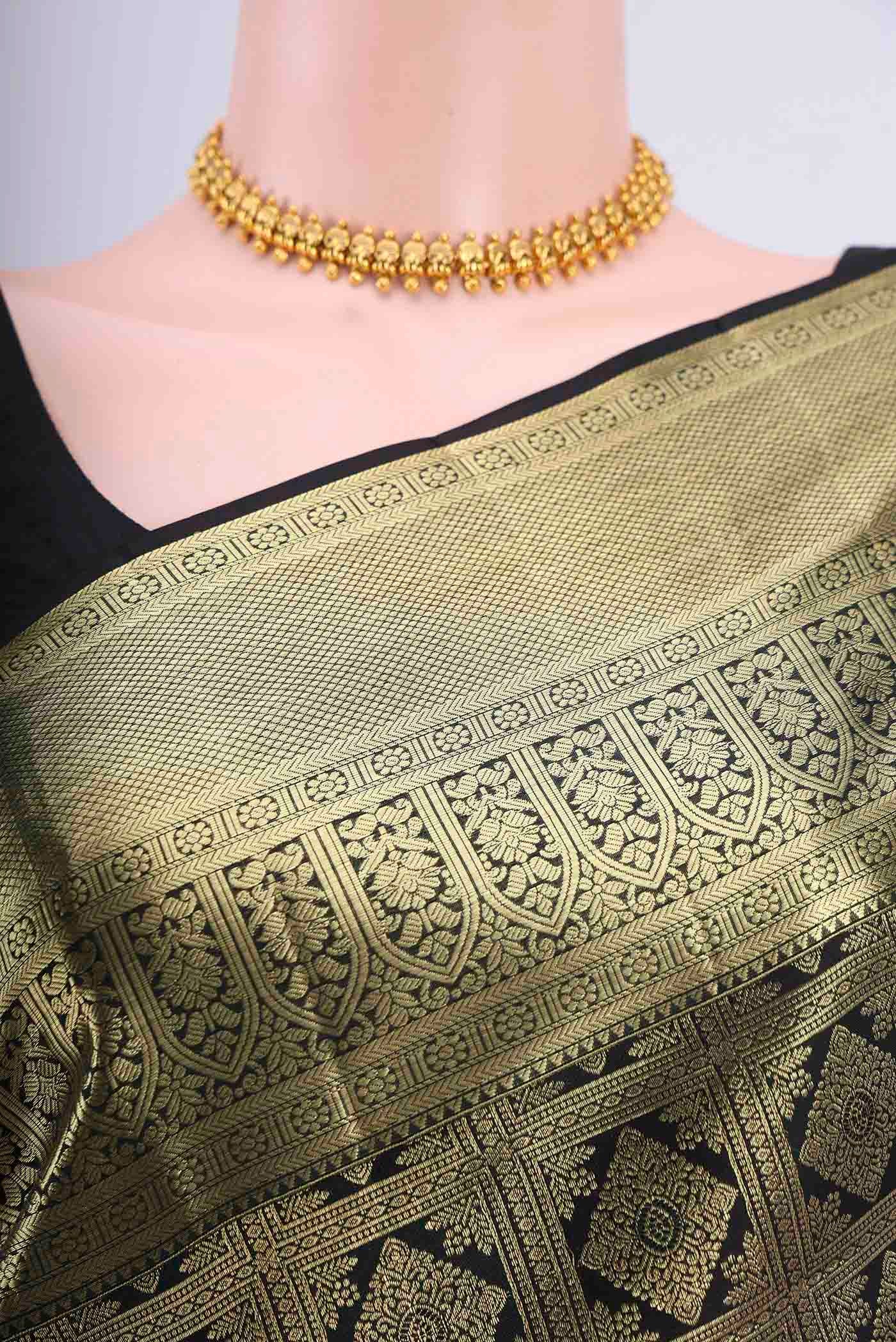 Border image of Black Kanchipuram Saree with Zari Brocade on the body and Zari Border