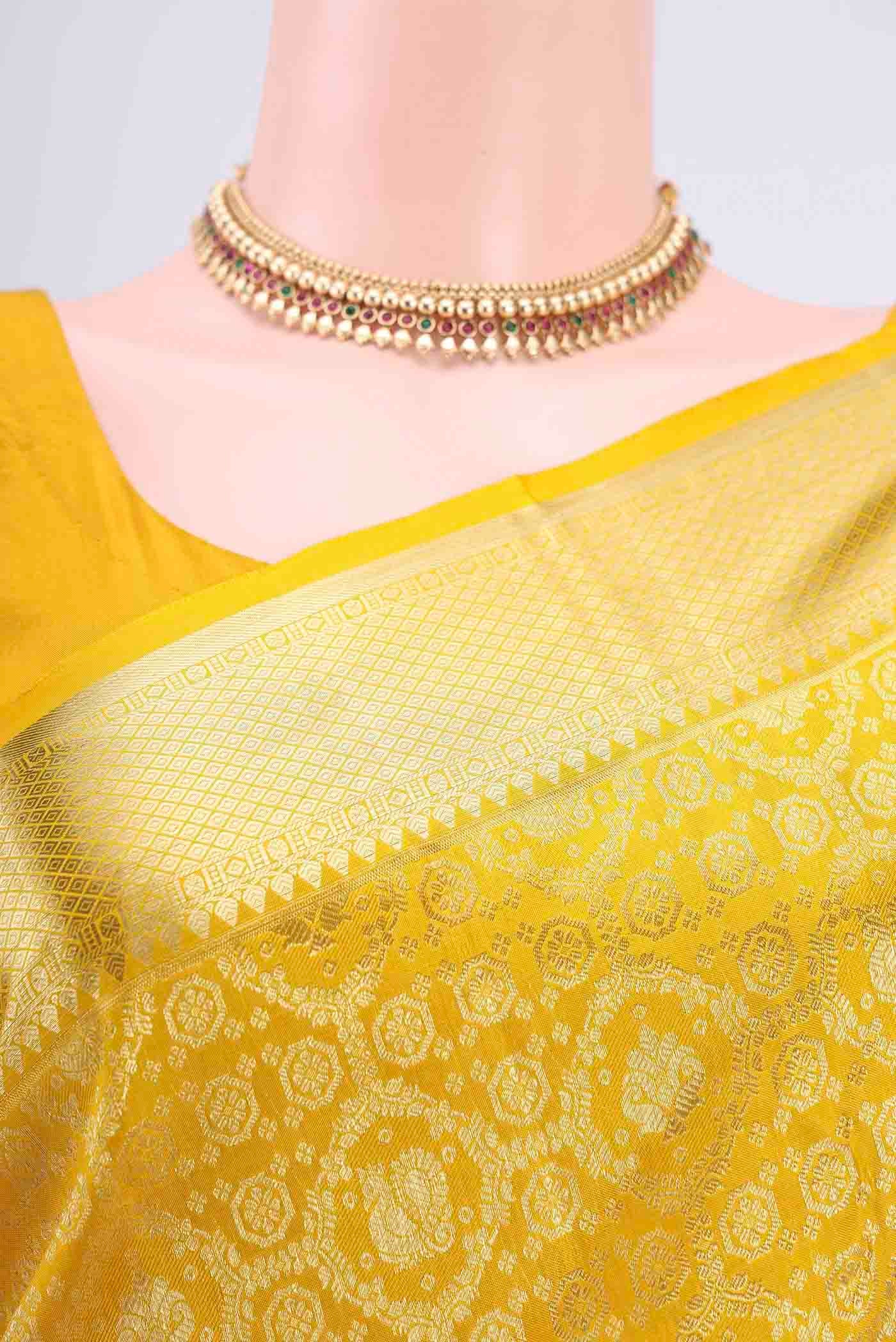 Border image of Lemon Yellow Kanchipuram Saree with Zari Brocade on the body and Zari Border