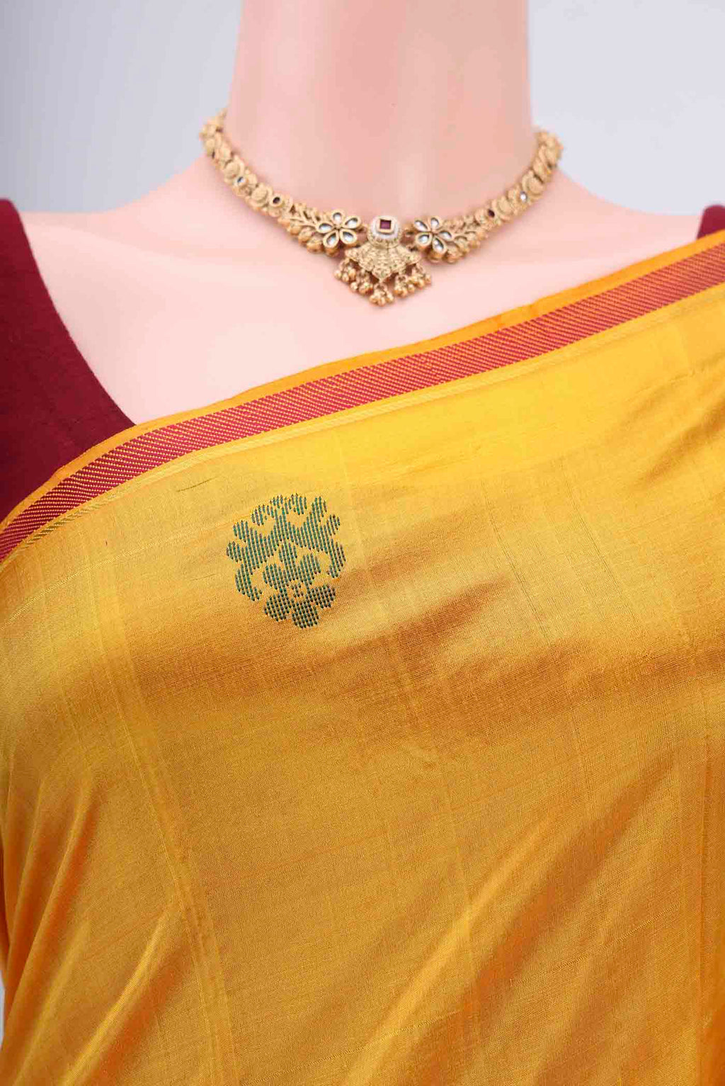 Border image of Yellow Kanchipuram Silk Saree with Plain Body and Zari And Thread Border. 