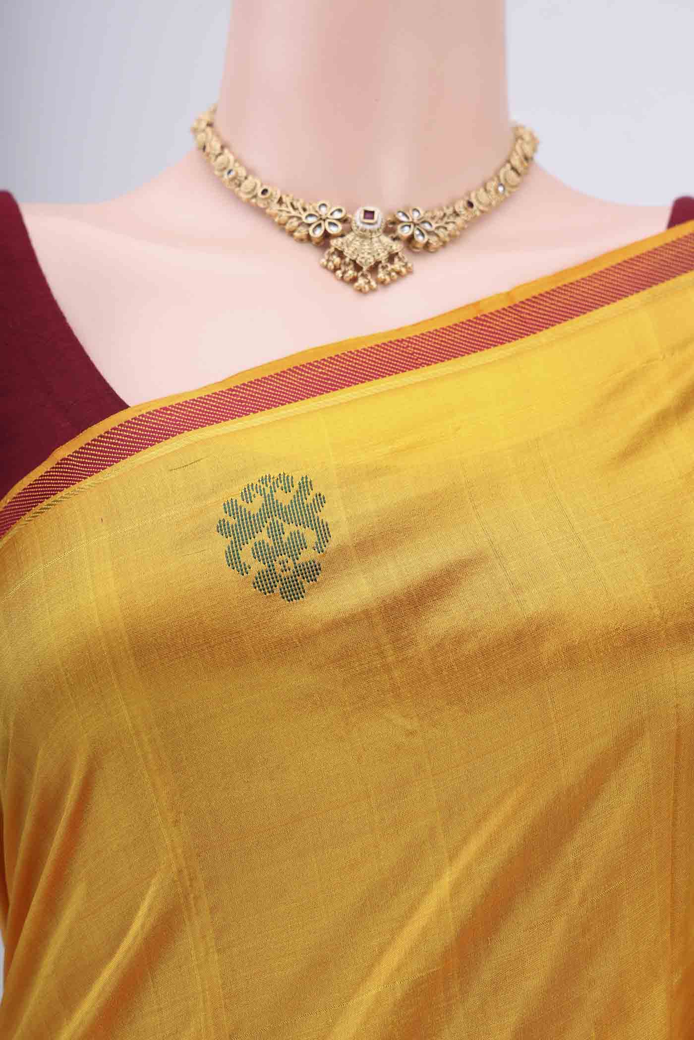 Border image of Yellow Kanchipuram Silk Saree with Plain Body and Zari And Thread Border. 