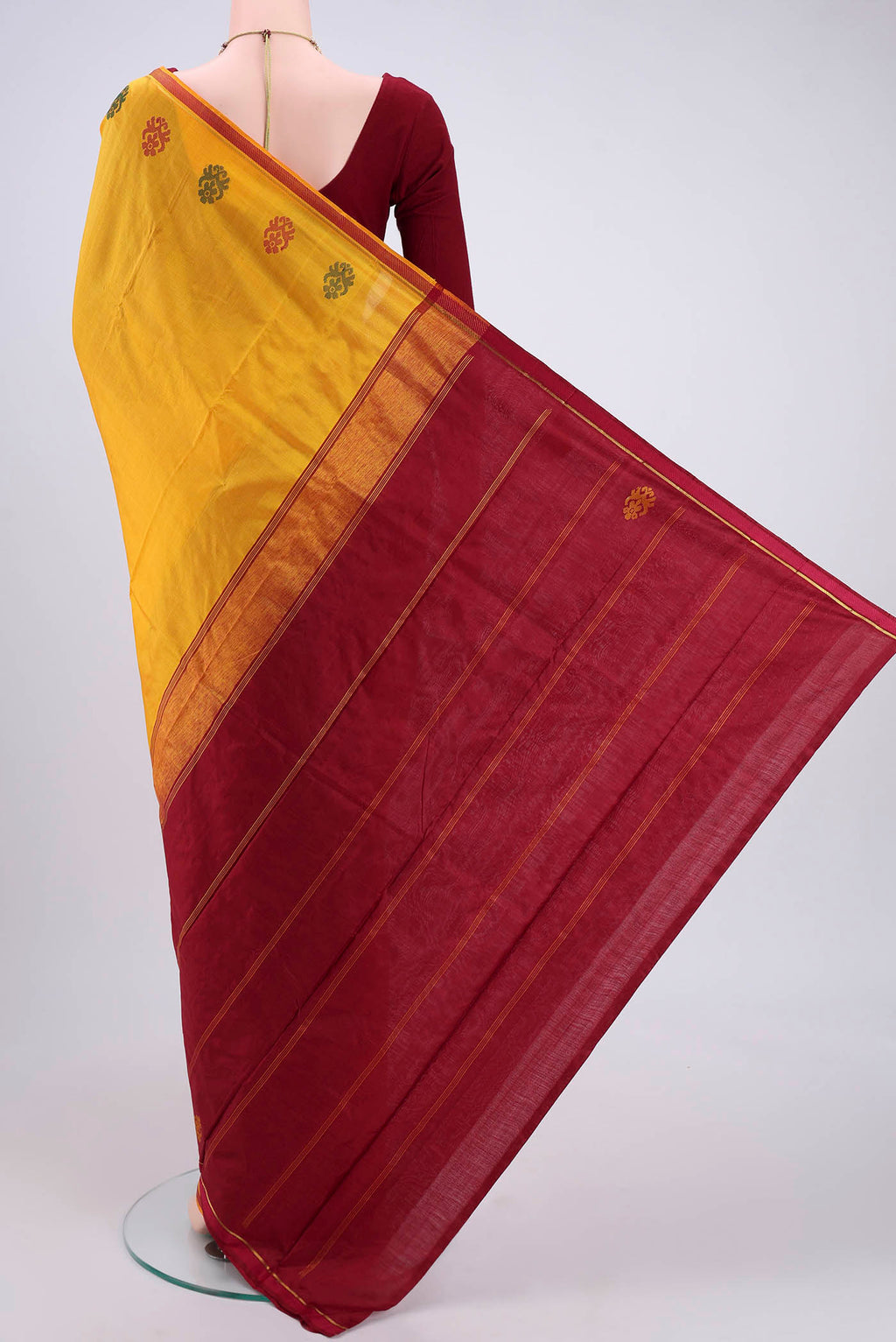 Flat view of Yellow Kanchipuram Silk Saree with Plain Body and Zari And Thread Border. 