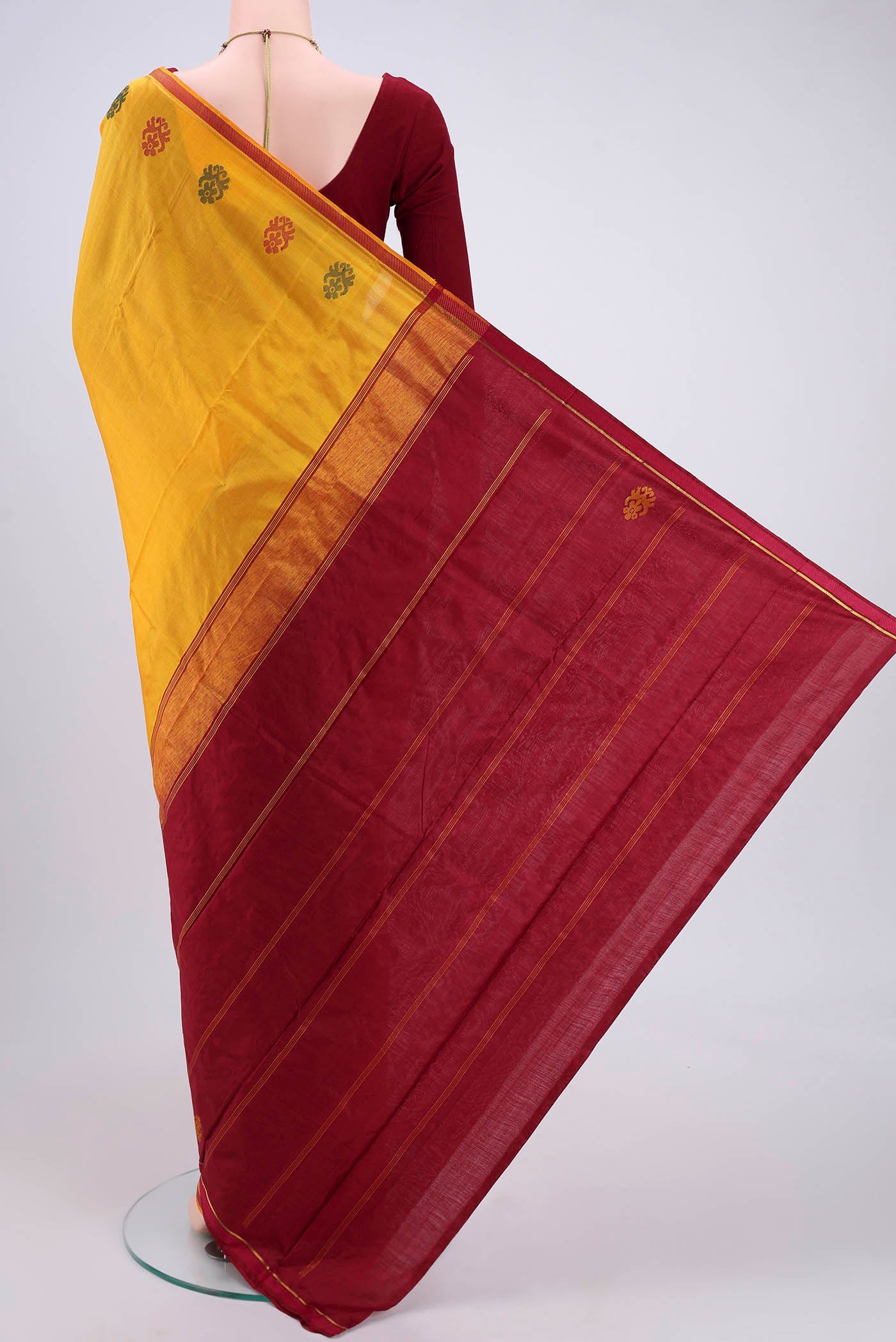 Flat view of Yellow Kanchipuram Silk Saree with Plain Body and Zari And Thread Border. 