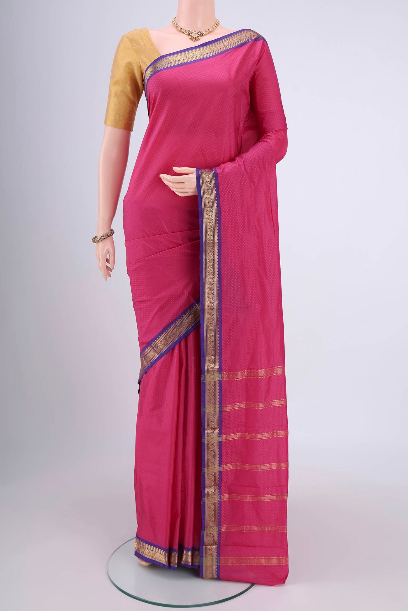 Rose pink Blended Bangalore Silk Saree with Zari Butta on the body and Zari Border.  displayed on a mannequin