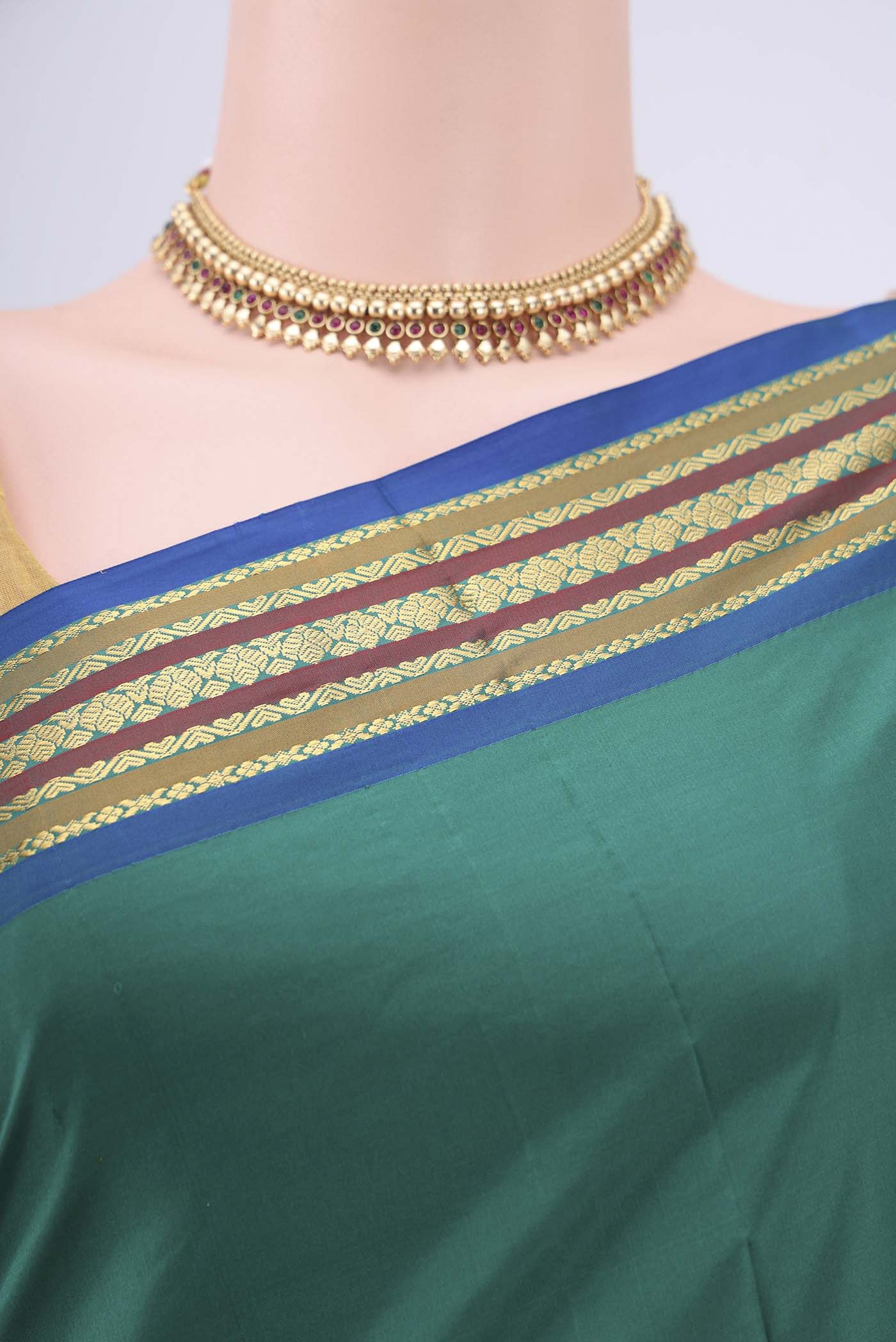 Border image of Green Blended Bangalore Silk Saree with Zari Butta on the body and Zari Border. 