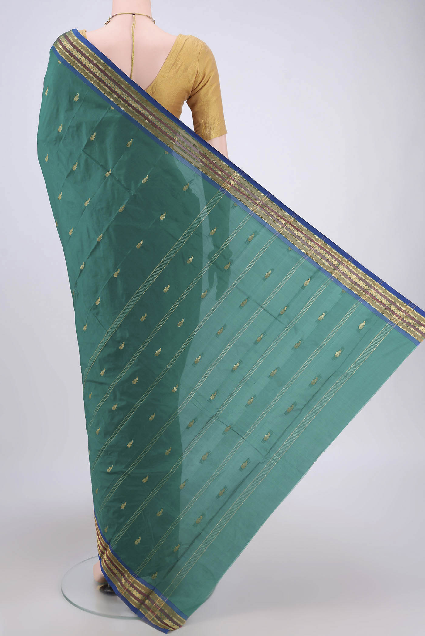 Flat view of Green Blended Bangalore Silk Saree with Zari Butta on the body and Zari Border. 