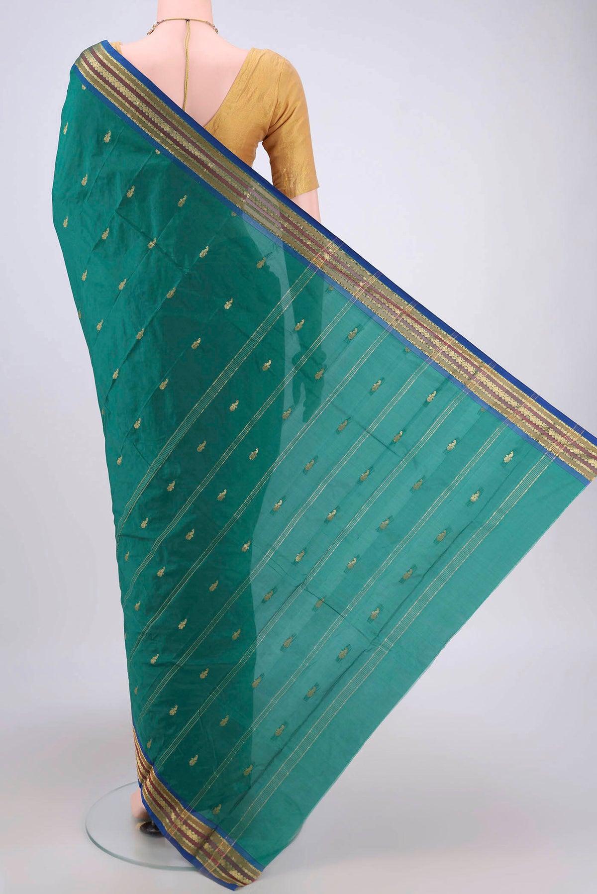 Flat view of Green Blended Bangalore Silk Saree with Zari Butta on the body and Zari Border. 