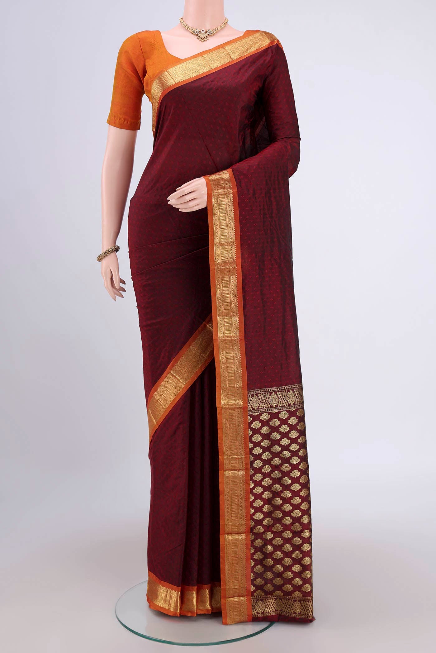 Maroon Dual Tone Blended Bangalore Silk Saree with Jacquard design on the body and Zari Border.  displayed on a mannequin