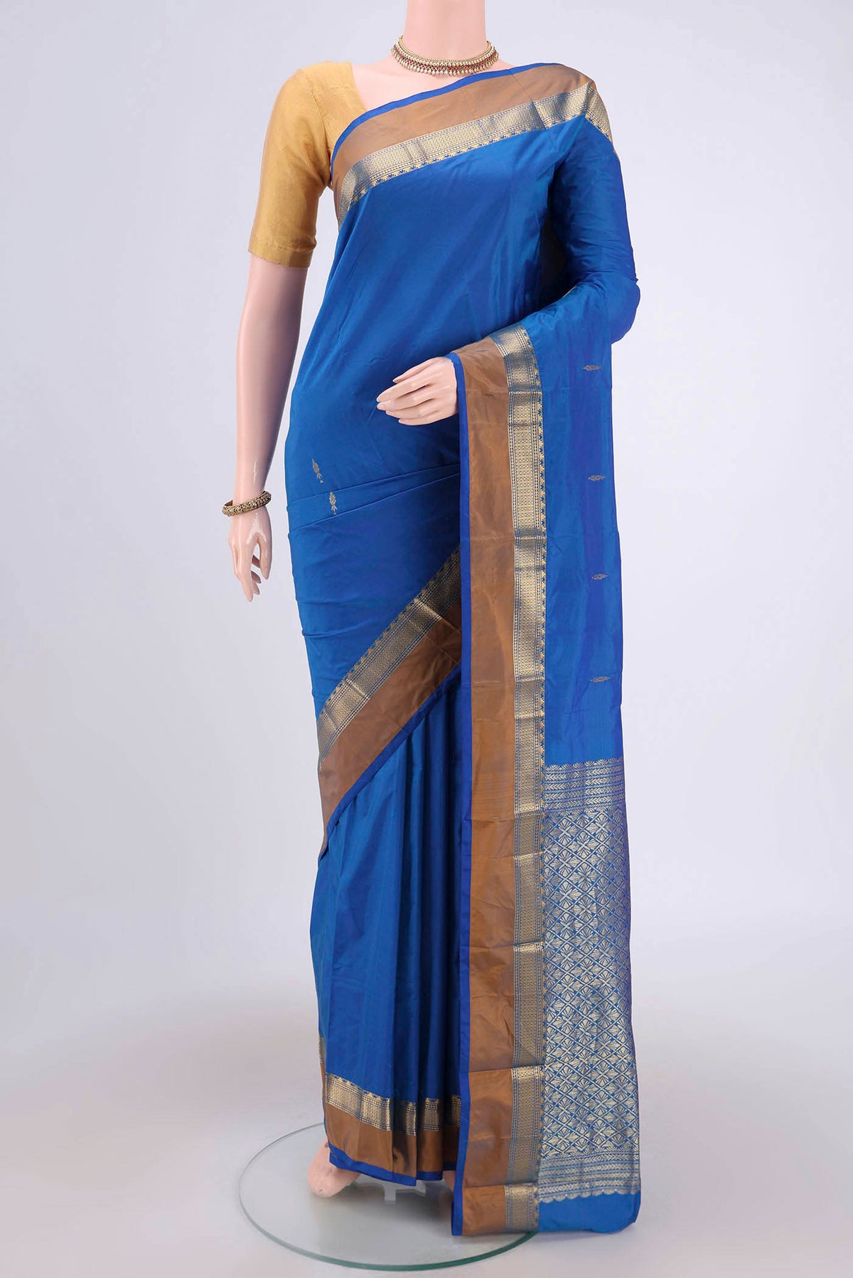 Royal Blue Blended Bangalore Silk Saree with Zari Butta on the body and Zari Border.  displayed on a mannequin