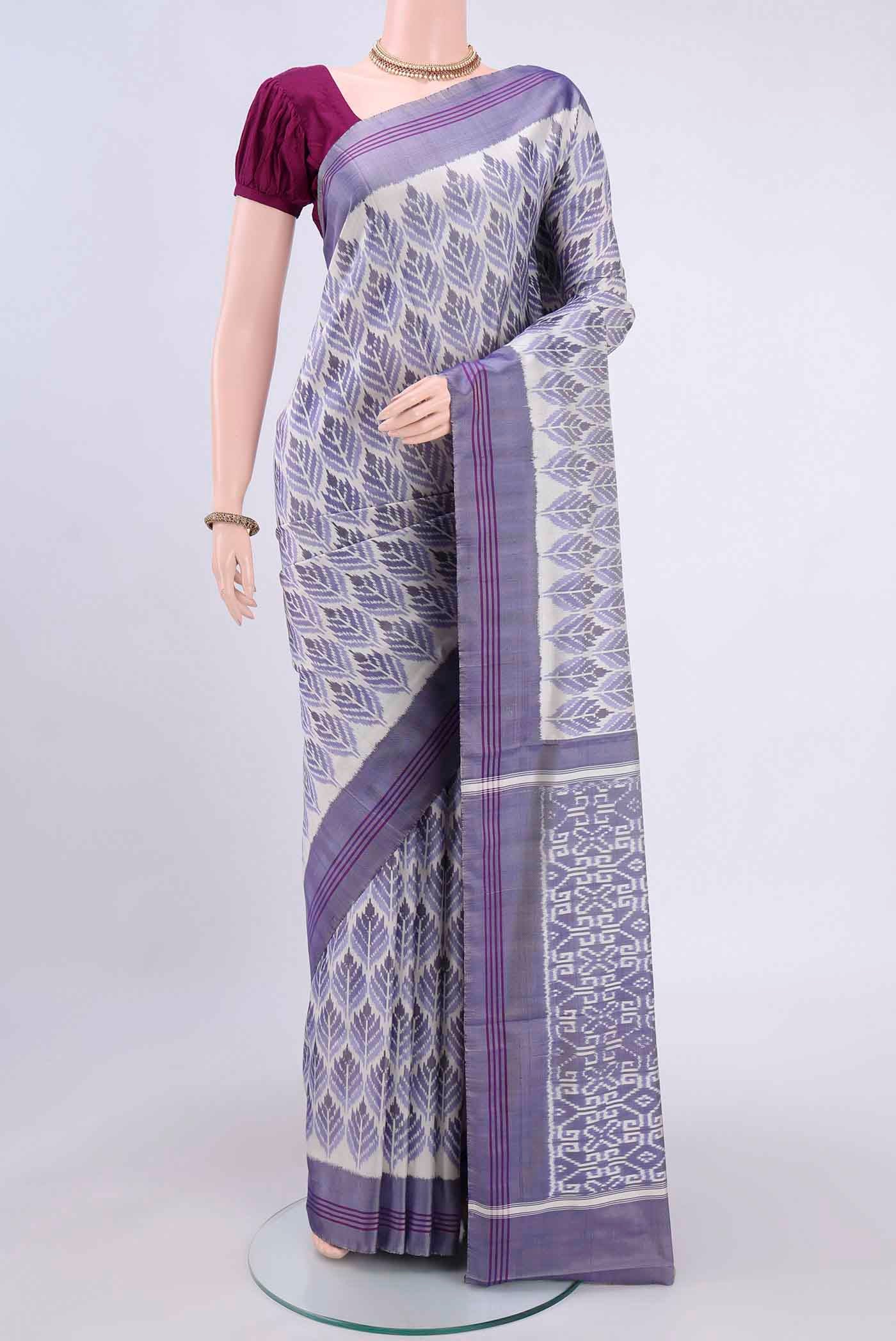 Off White Pochampally Silk Saree with Pure Ikat on the body and Plain Border displayed on a mannequin