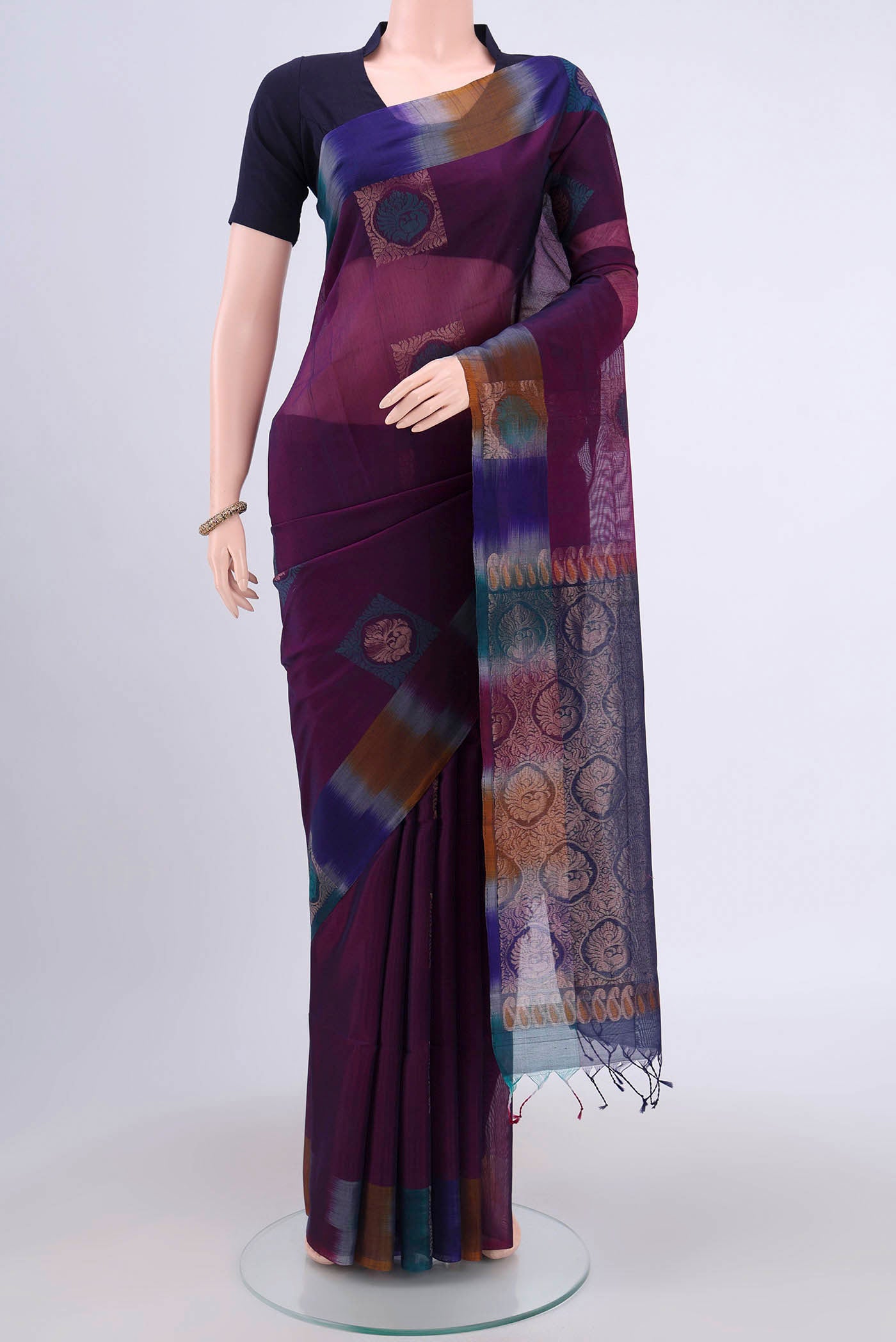 Dark Mauve Kora Cotton Saree with Zari Butta on the body and Zari Border.  displayed on a mannequin