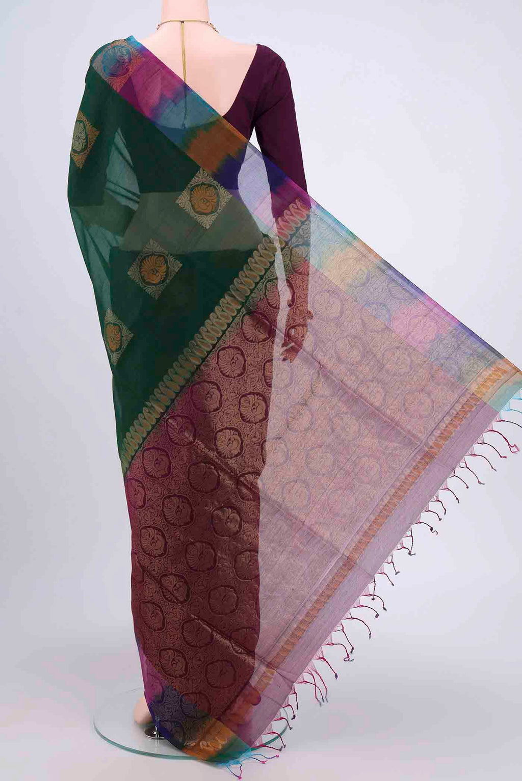 Flat view of Bottle Green Kora Cotton Saree with Zari Butta on the body and Zari Border. 