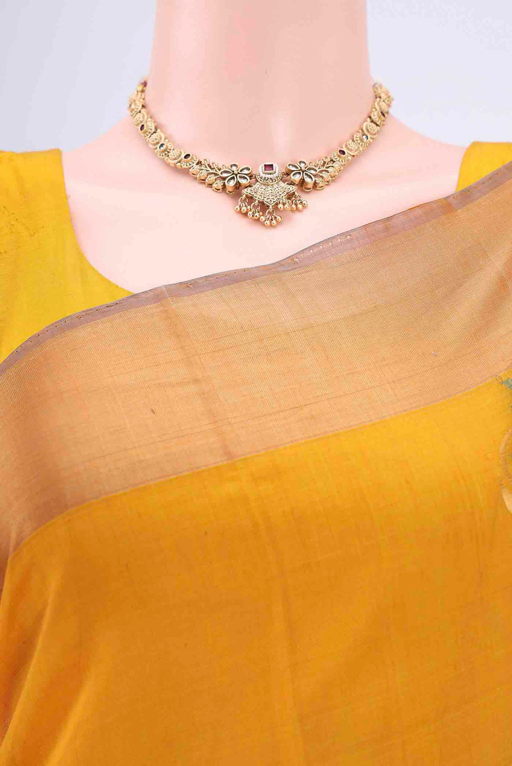 Border image of Yellow Kora Cotton Saree with Zari Butta on the body and Zari Border. 