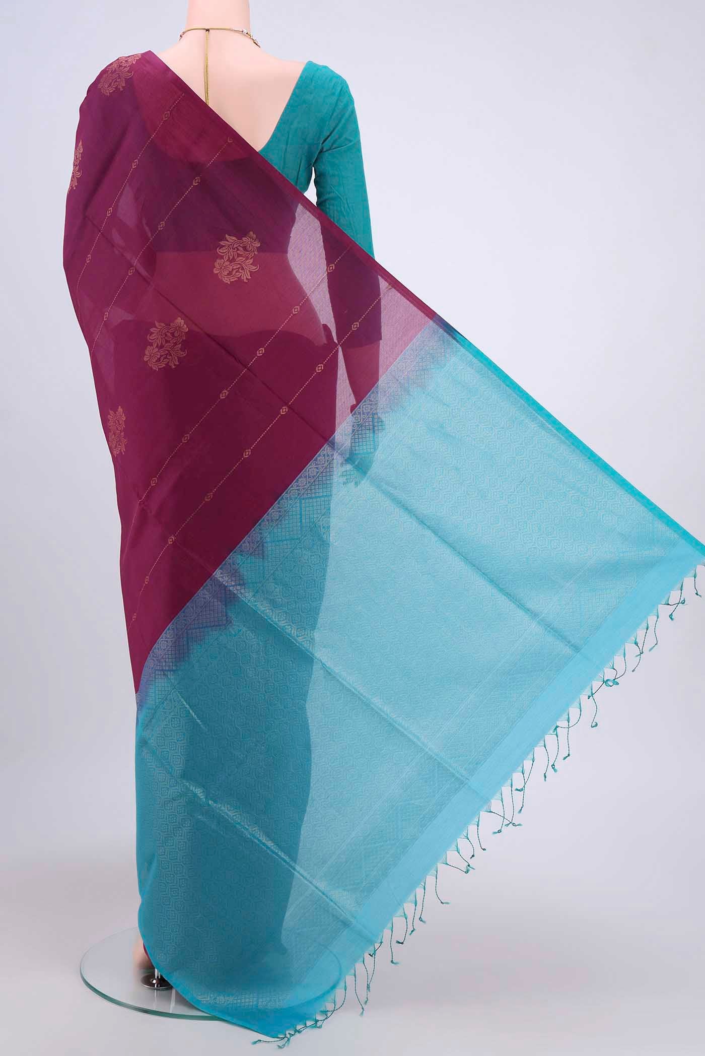 Flat view of Mauve Kora Cotton Saree with Zari Butta on the body and Zari Border. 