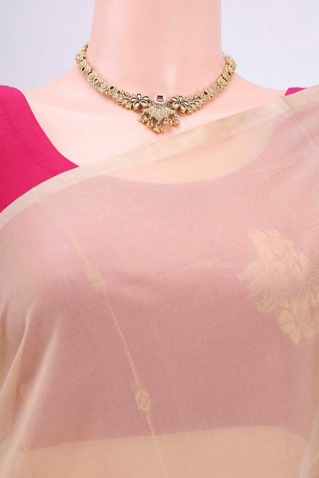 Border image of Beige Kora Cotton Saree with Zari Butta on the body and Zari Border. 