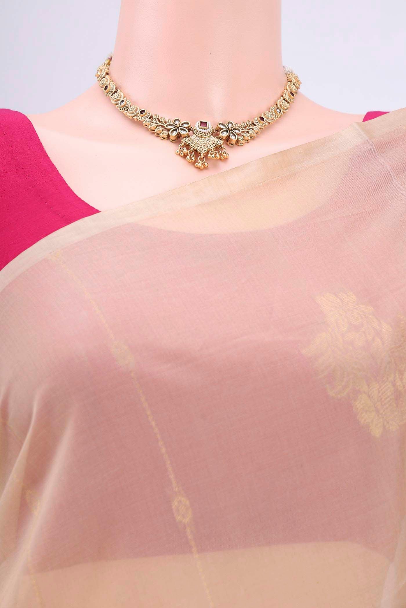 Border image of Beige Kora Cotton Saree with Zari Butta on the body and Zari Border. 